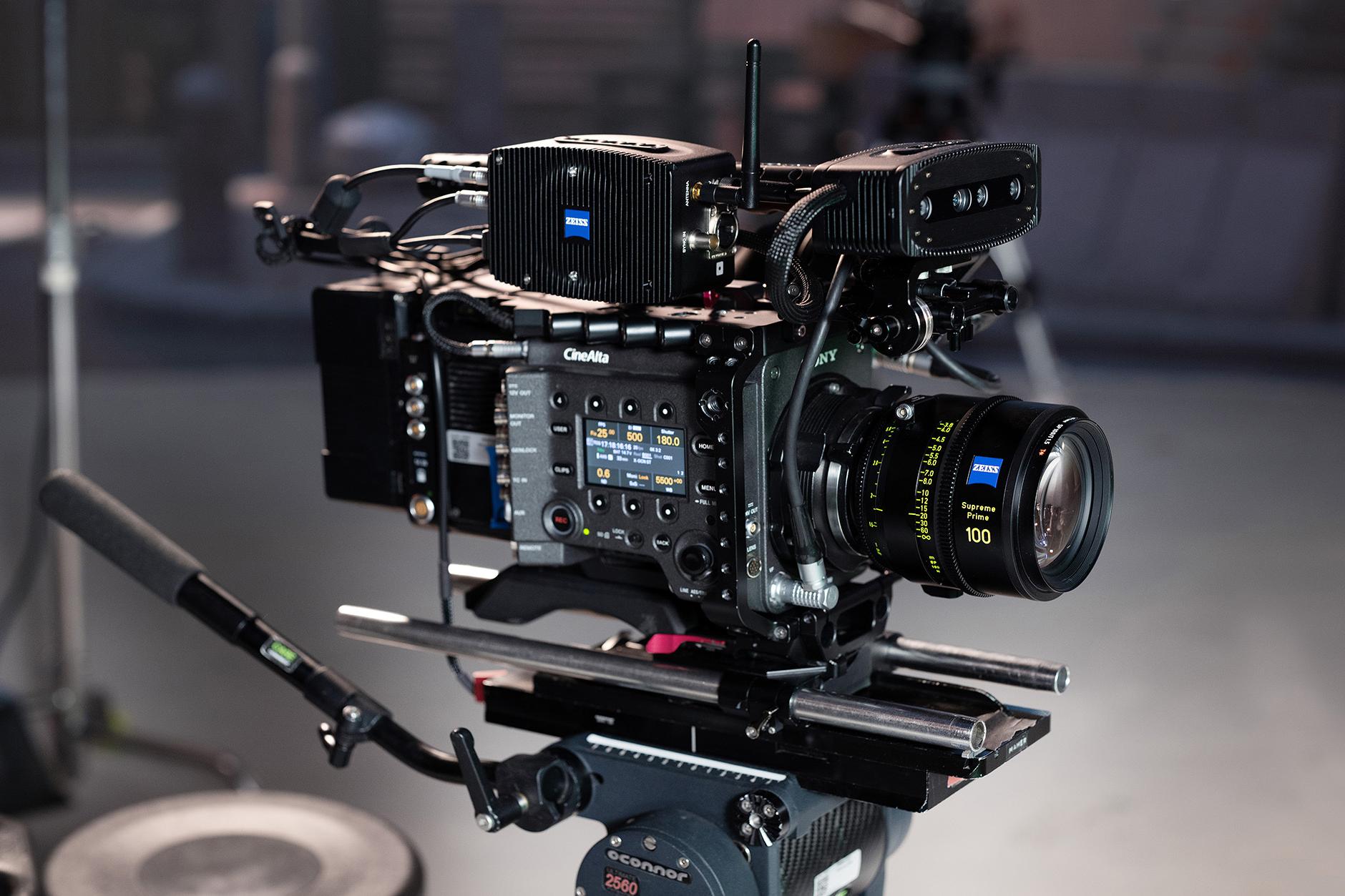 Professional cinema camera rig equipped with a ZEISS Supreme Prime 100mm lens and multiple ZEISS accessories mounted on a tripod.