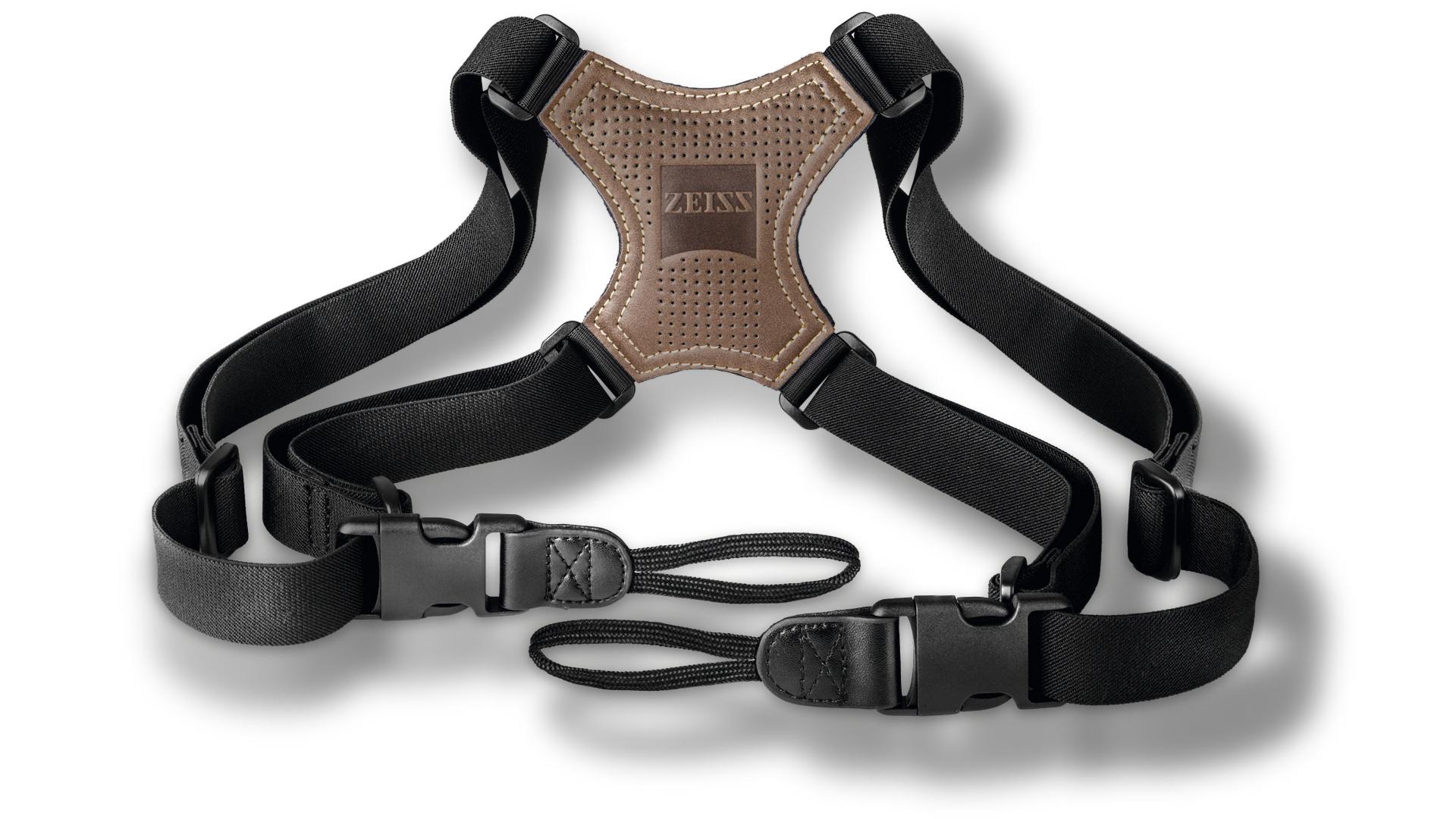 ZEISS branded brown and black harness strap with adjustable buckles and loops for carrying optical equipment.