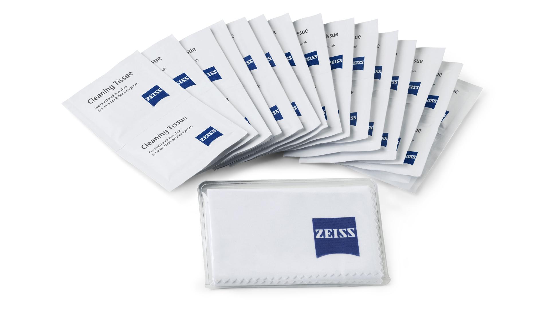 Multiple individually wrapped ZEISS cleaning tissues are displayed in a fan arrangement behind a folded ZEISS-branded cleaning cloth in a transparent pouch.