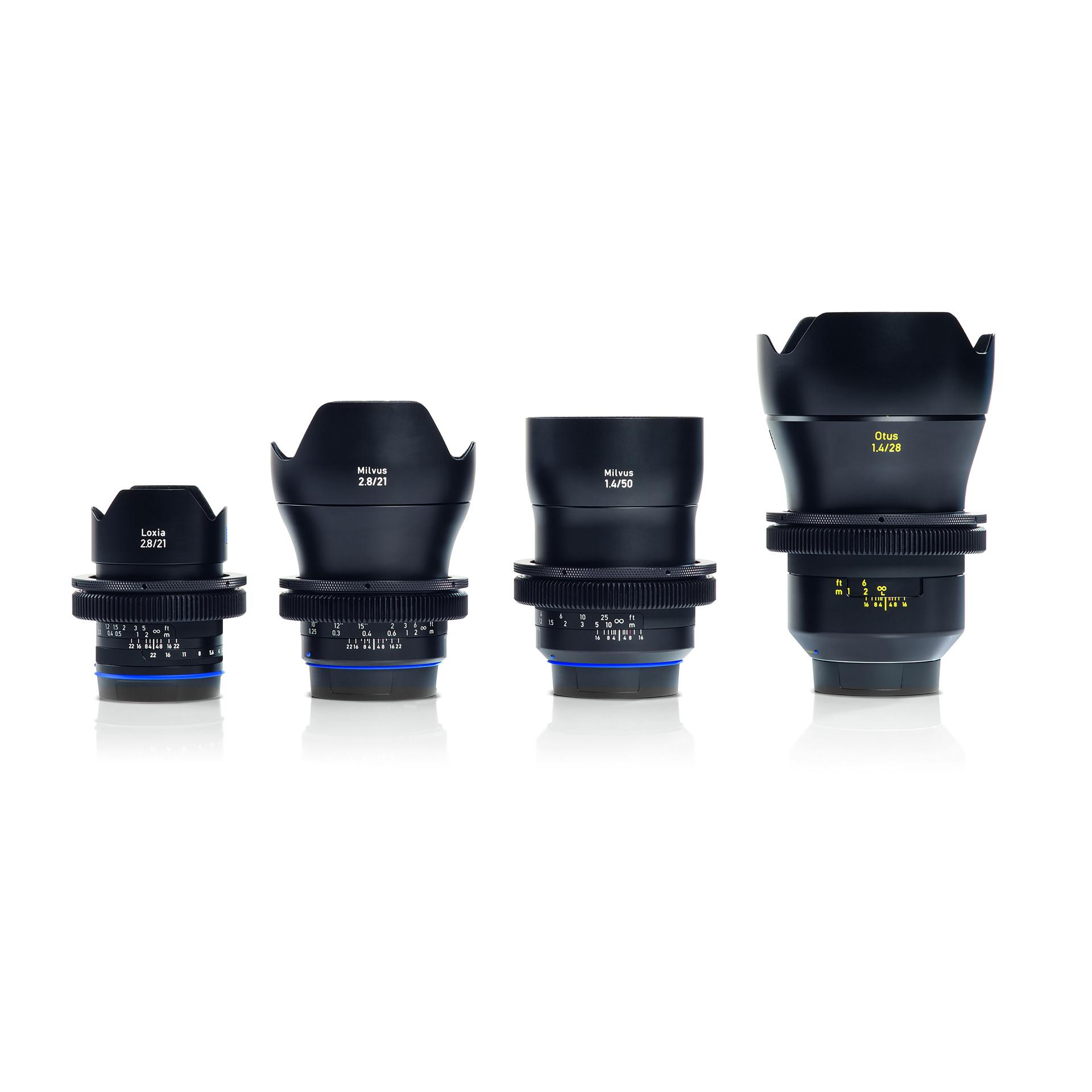 Four professional ZEISS camera lenses of varying sizes and focal lengths are displayed in a row on a white background.