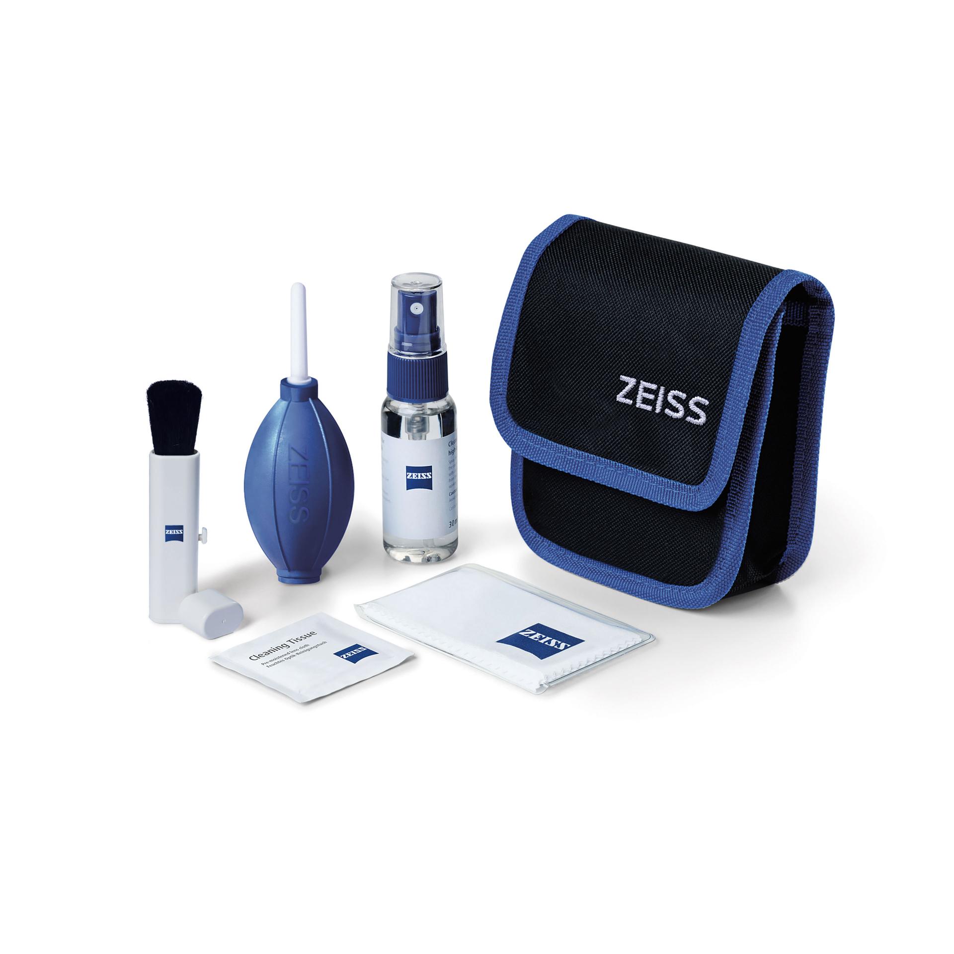 ZEISS camera cleaning kit including a lens cleaning brush, air blower, cleaning spray, microfiber cloths, and a black and blue carrying pouch with ZEISS branding.