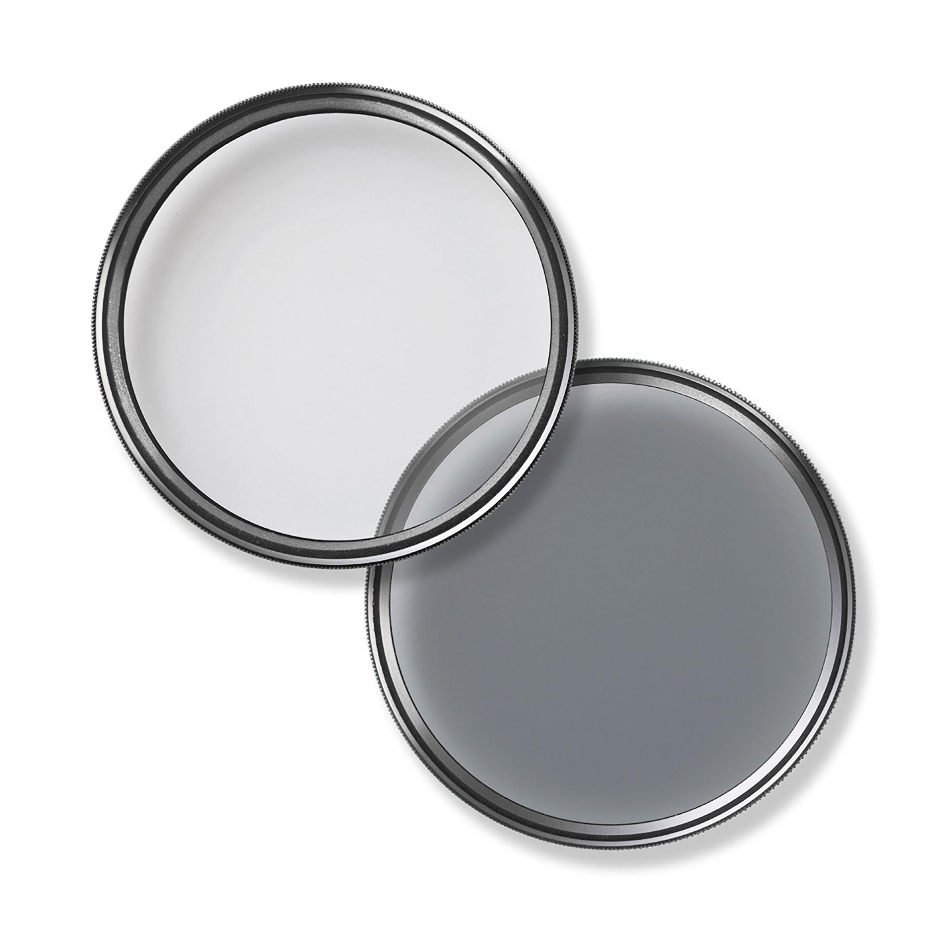 Two circular ZEISS camera lens filters with metallic rims, one clear and one tinted, overlapping against a white background.