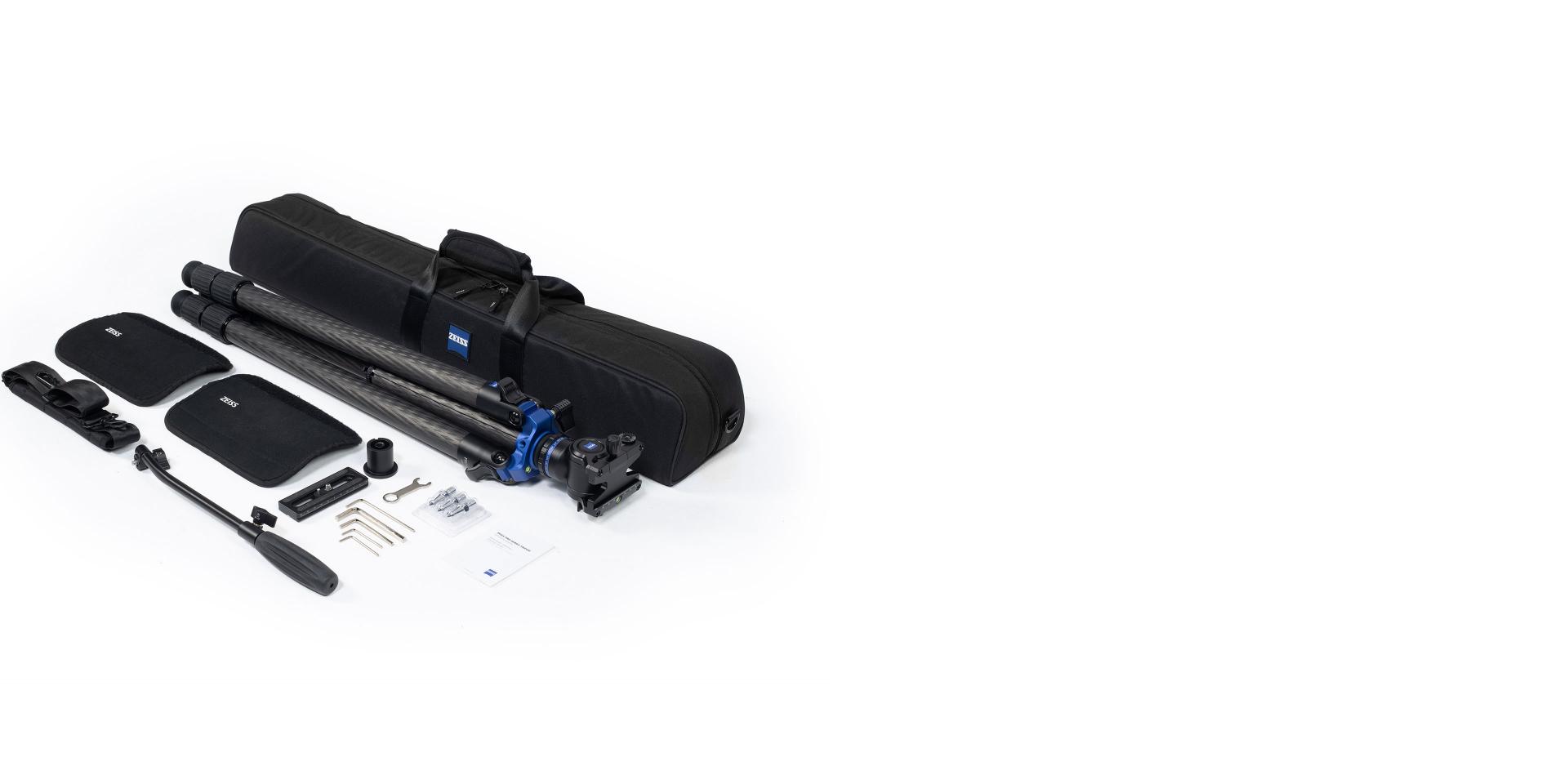 ZEISS camera tripod kit with carrying case, tripod, mounting accessories, tools, and instruction manuals laid out on a white background.