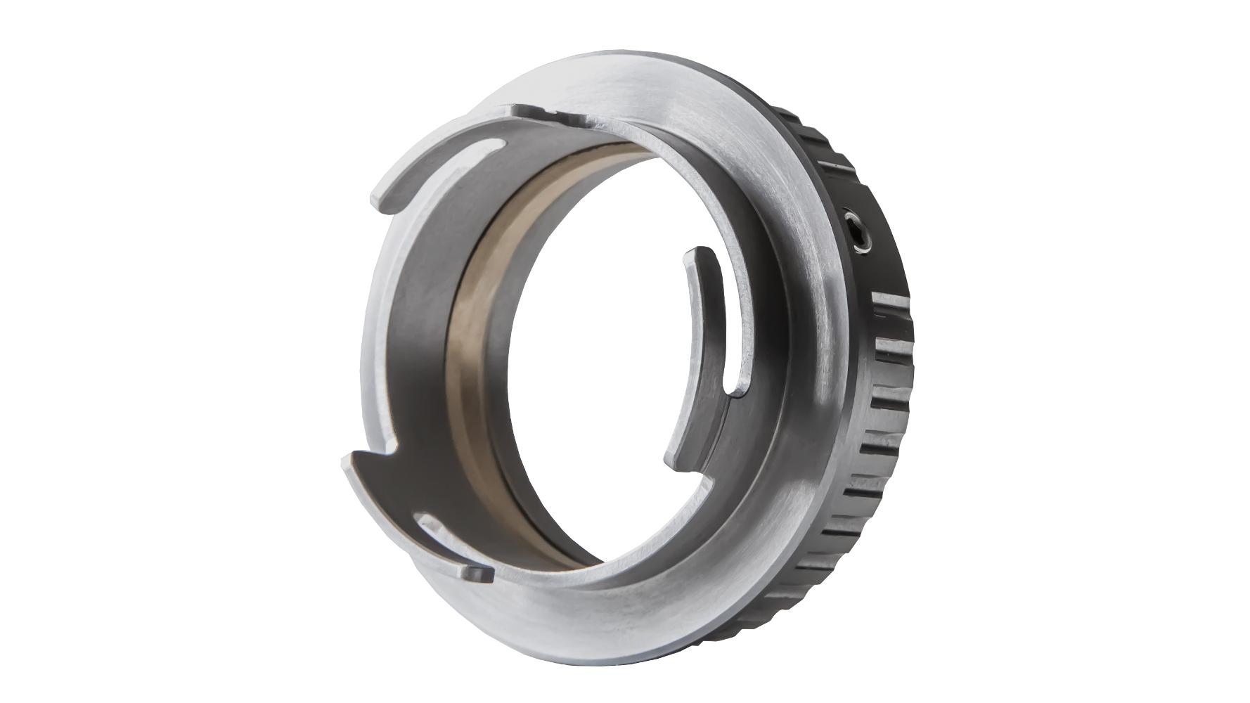 Close-up image of a ZEISS metal lens mount adapter with a silver finish and precision-machined details.