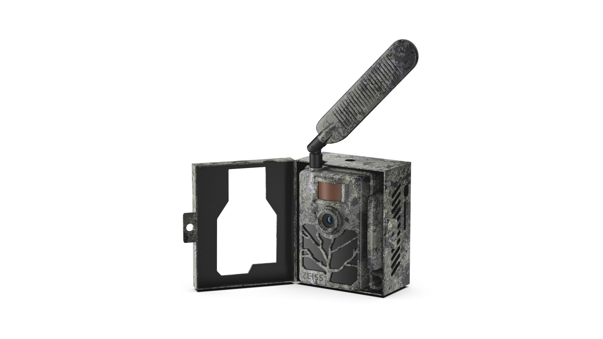 Camouflaged ZEISS trail camera with a large external antenna, shown mounted inside an open protective case.