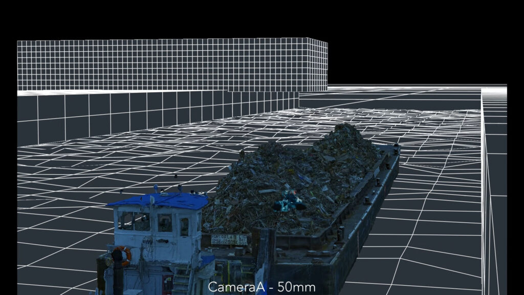 Two people are working with professional film production equipment, including a camera and monitor, in a studio setting featuring ZEISS lenses.