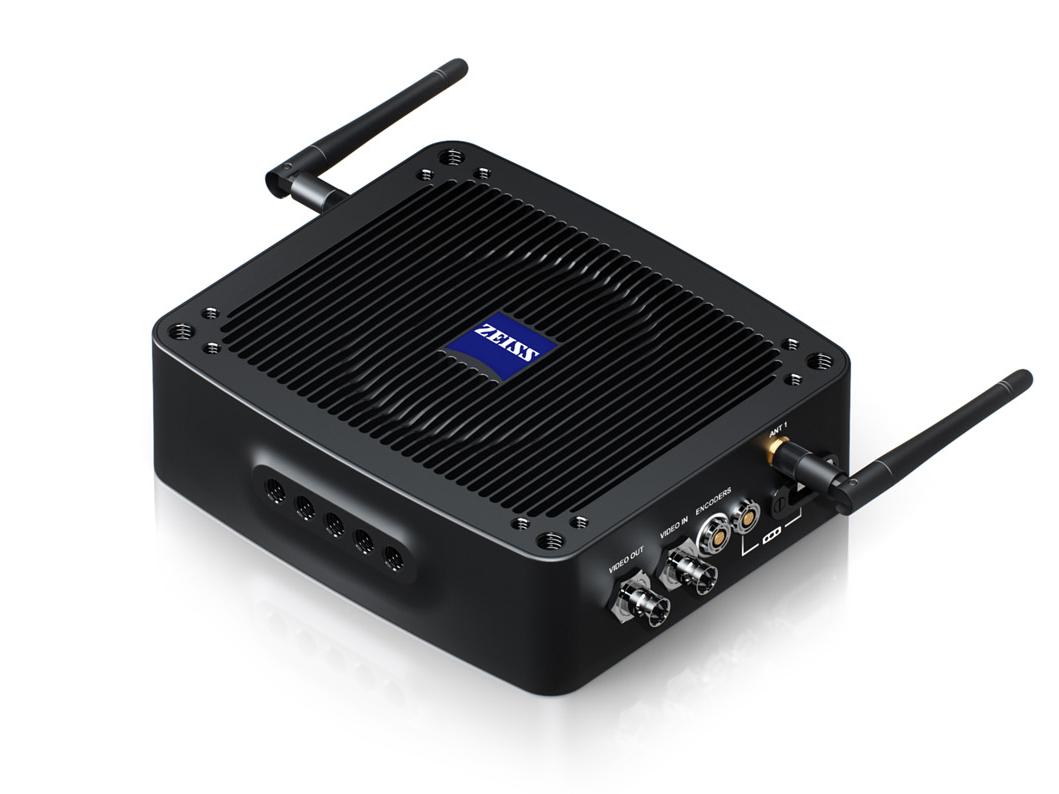 Black ZEISS electronic device with two antennas, ventilation grooves on top, and multiple video and data connection ports on the side.