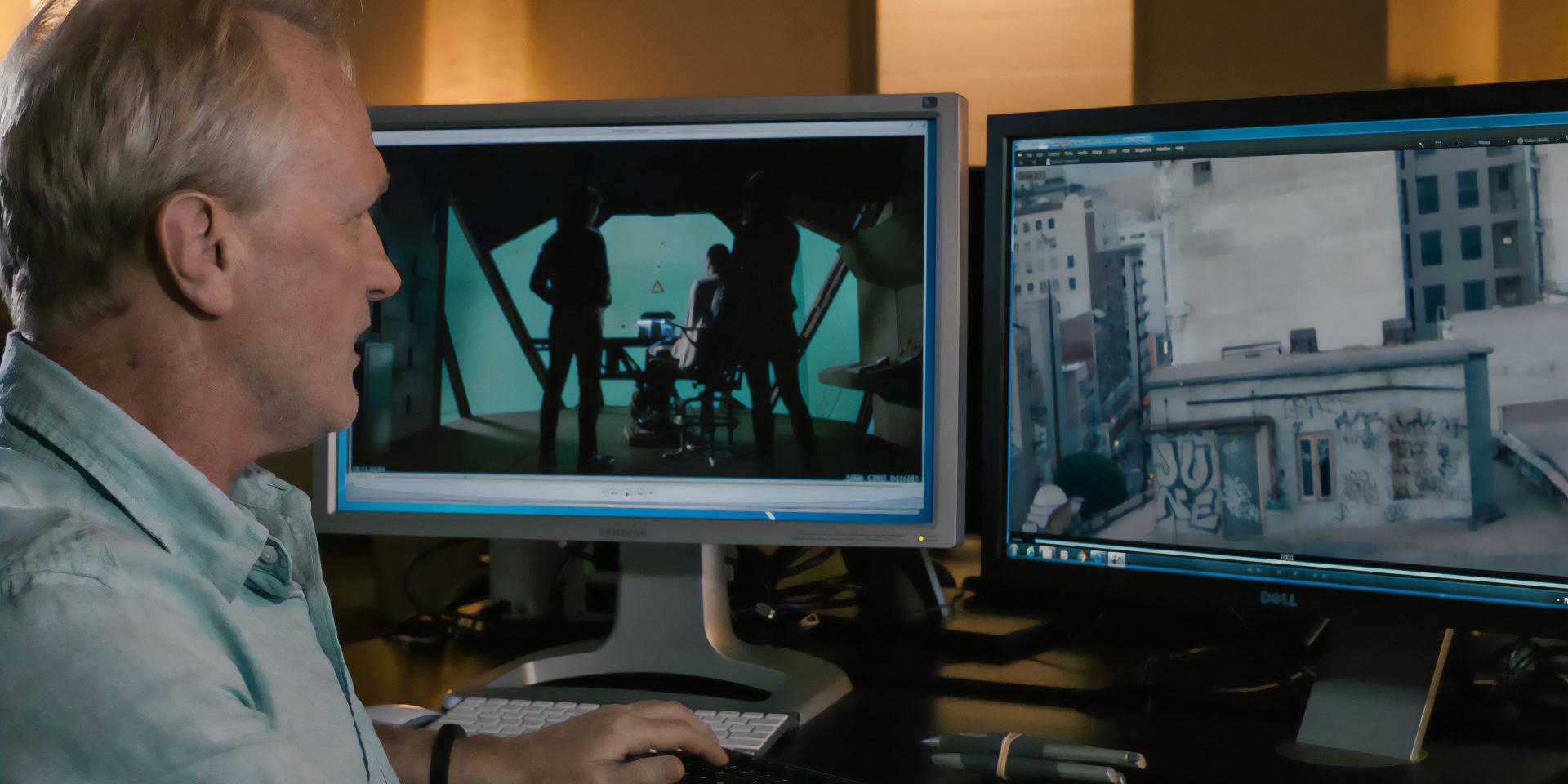 A man works at a dual-monitor editing station displaying a film scene and an urban cityscape, highlighting professional post-production with ZEISS optics.