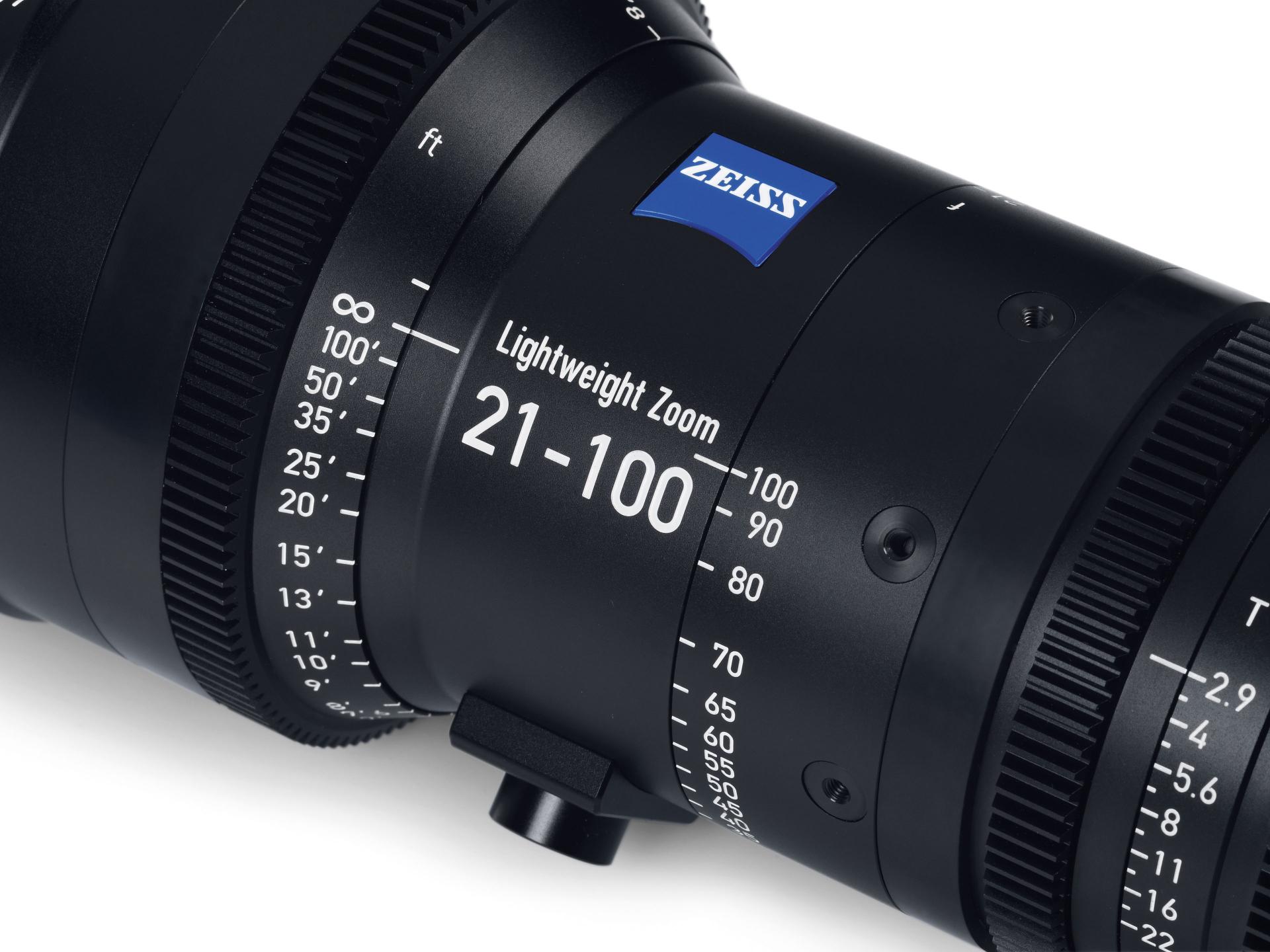 Close-up of a ZEISS Lightweight Zoom 21-100mm professional camera lens showing detailed focus and zoom markings.
