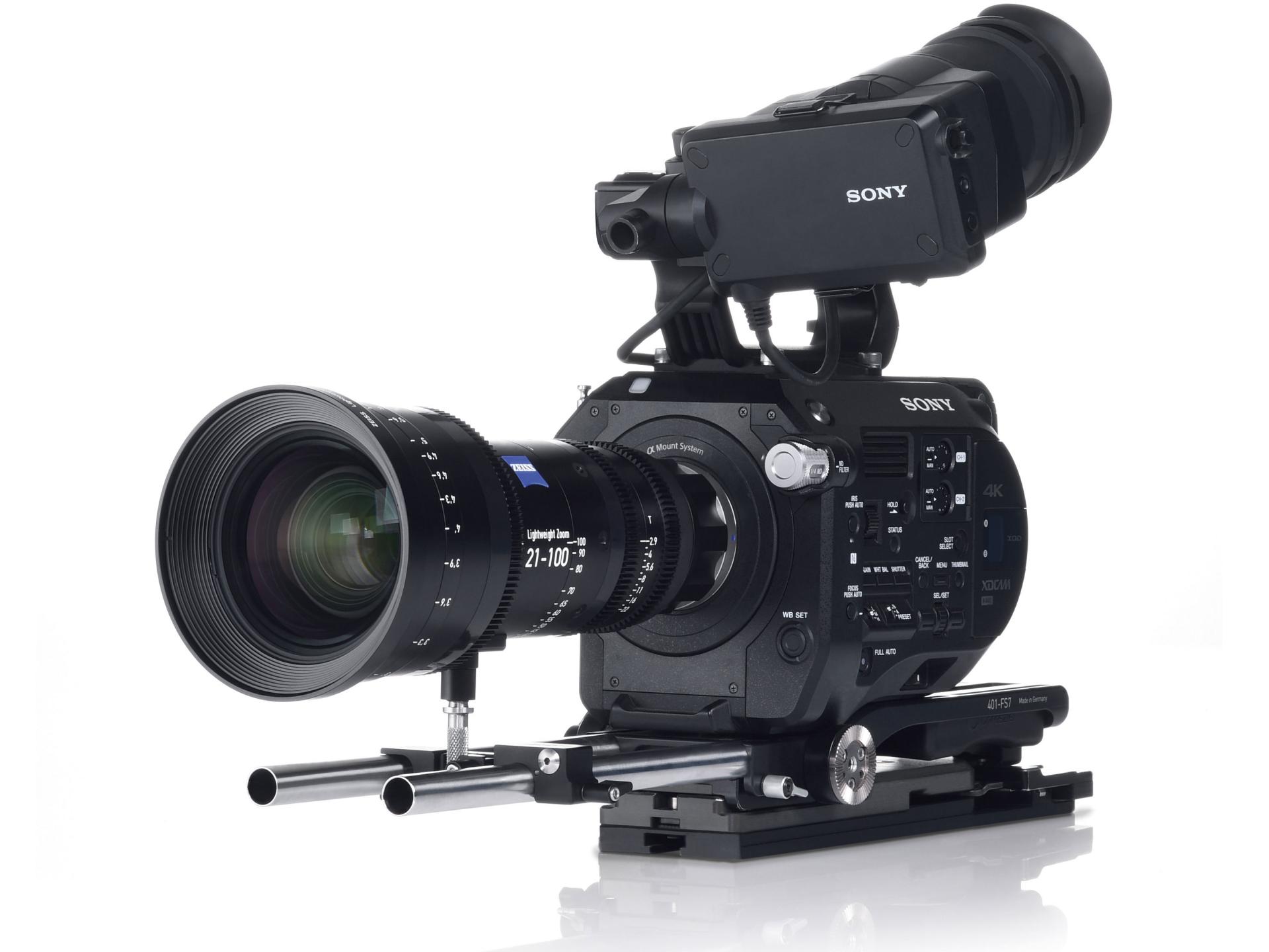 Professional video camera setup featuring a ZEISS lens mounted on a SONY cinema camera with rails and accessories.