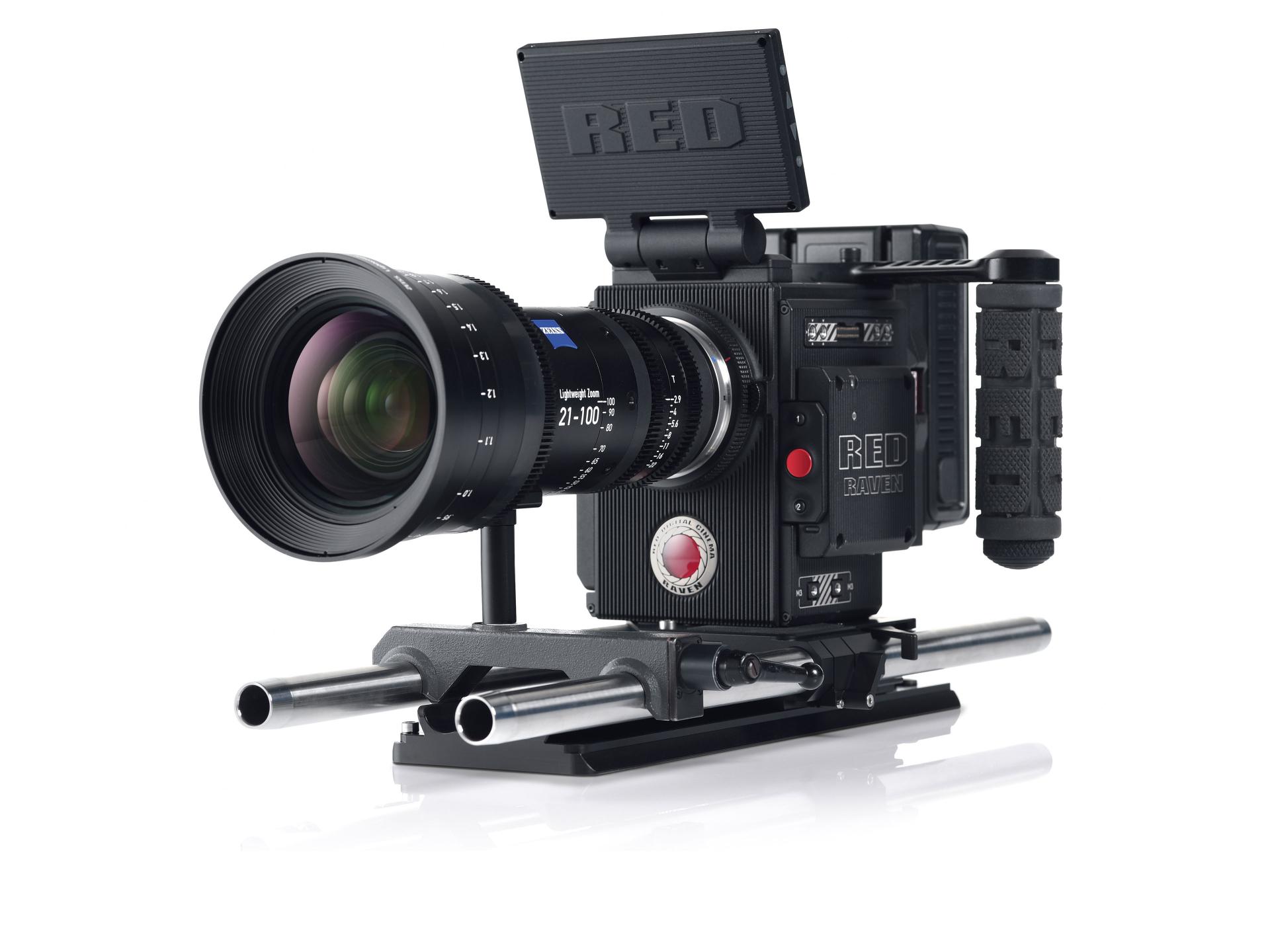 Professional cinema camera setup featuring a RED digital camera body equipped with a ZEISS 21-100mm zoom lens mounted on a support rig.