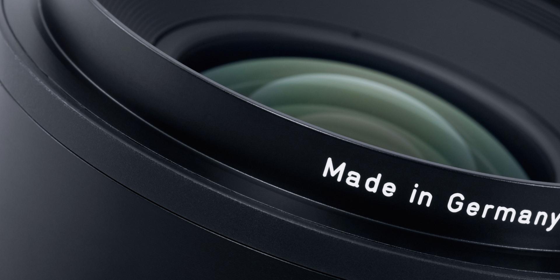 Close-up view of a ZEISS camera lens with the inscription "Made in Germany" on the lens barrel.