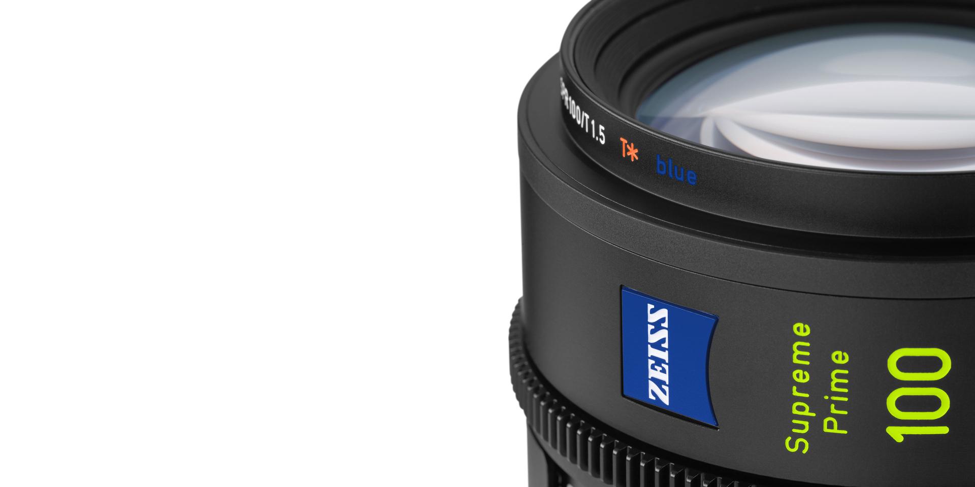 Close-up of a ZEISS Supreme Prime 100mm camera lens showing the ZEISS logo and detailed lens markings.