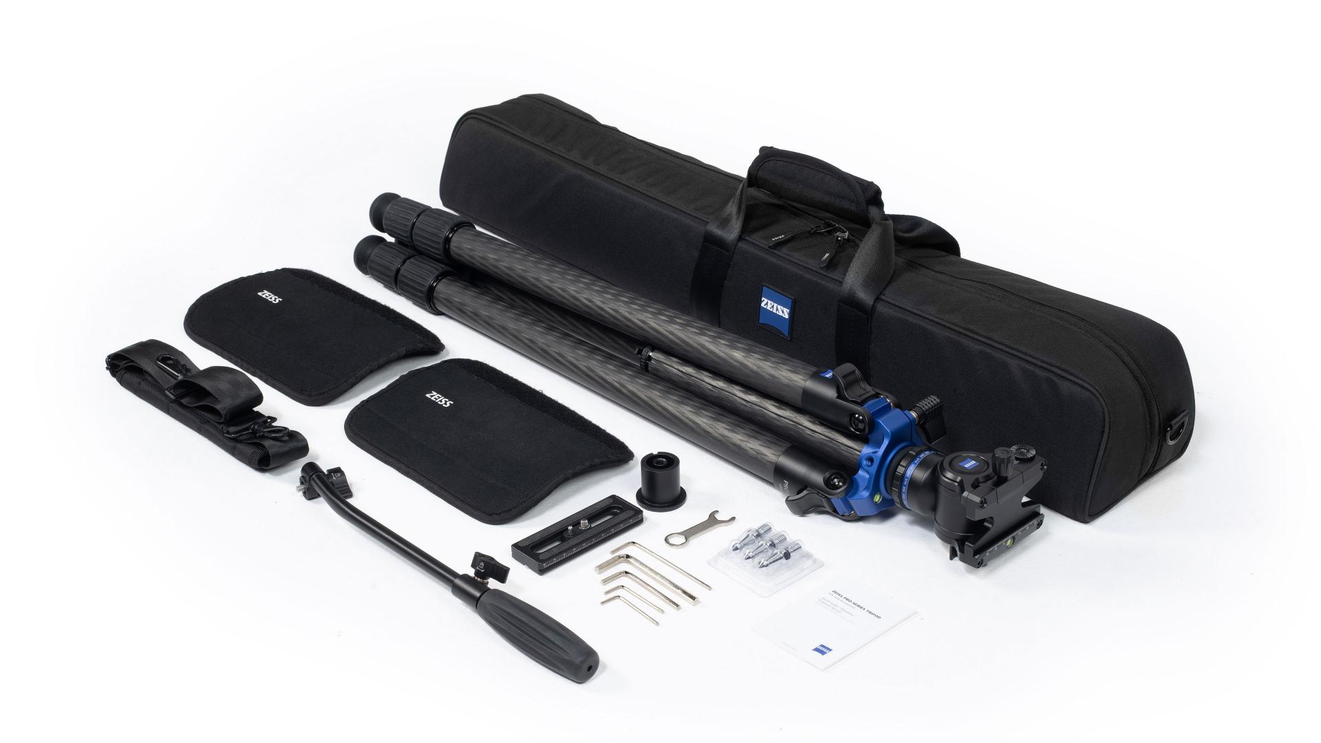 ZEISS professional tripod kit including a carbon fiber tripod, carrying case, handle, mounting plate, tools, and accessories neatly arranged on a white background.