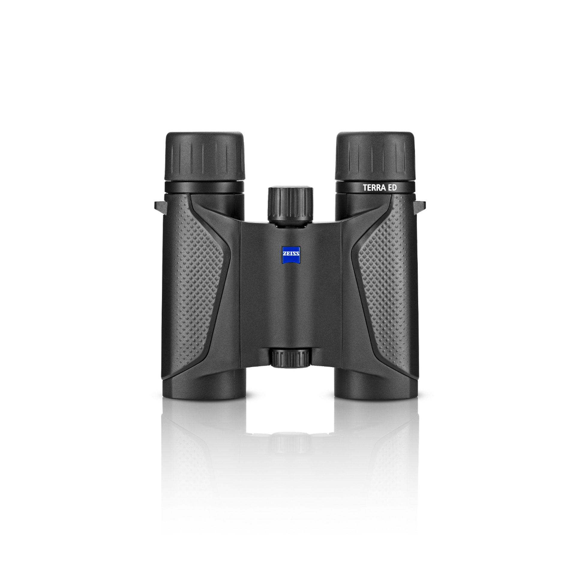  ZEISS TERRA ED binoculars with textured grips and central focus wheel, displayed upright on a white reflective surface.