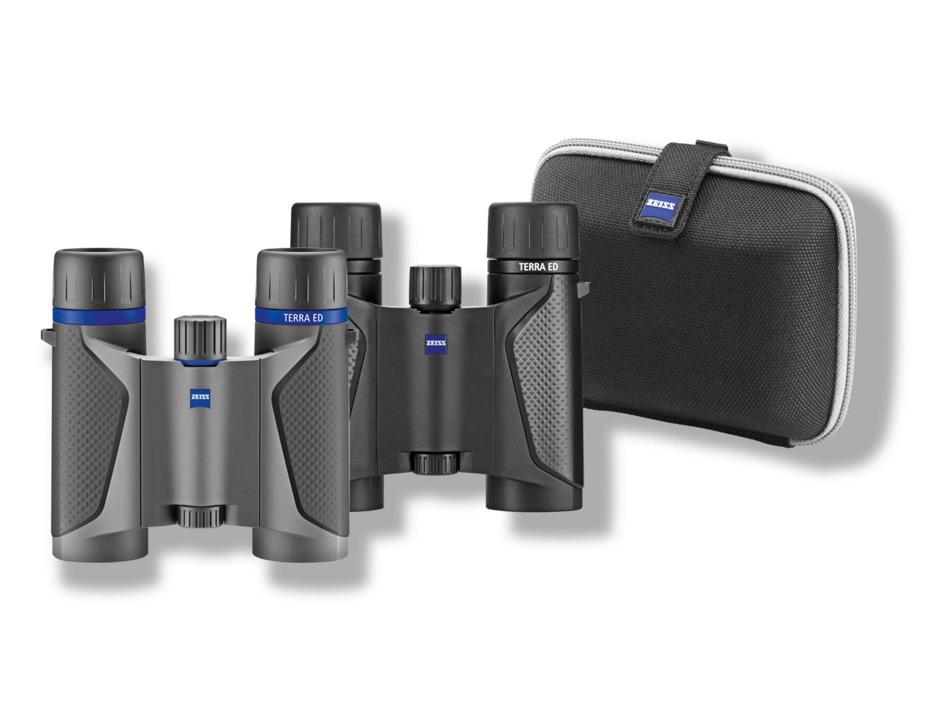 Compact ZEISS TERRA ED binoculars in sleek grey and black design shown alongside a matching black zippered carrying case.
