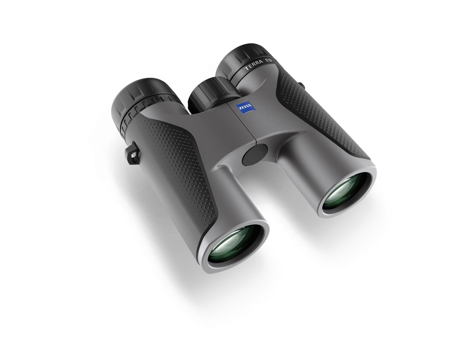 Black and gray ZEISS binoculars with textured grips and green-tinted objective lenses, viewed at an angle on a white background.