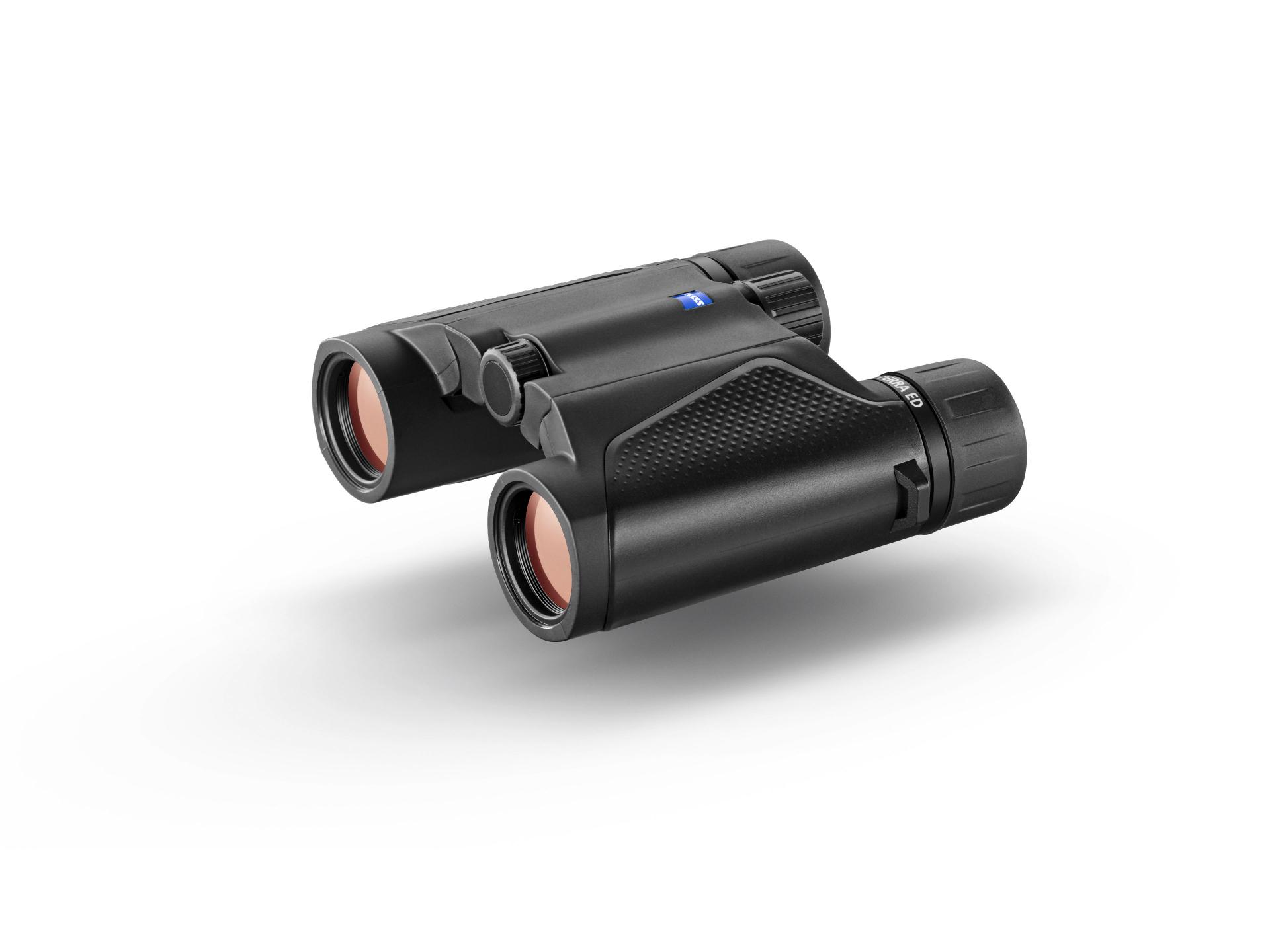 Compact black ZEISS binoculars with textured grip and red-tinted lenses, displayed on a white background.