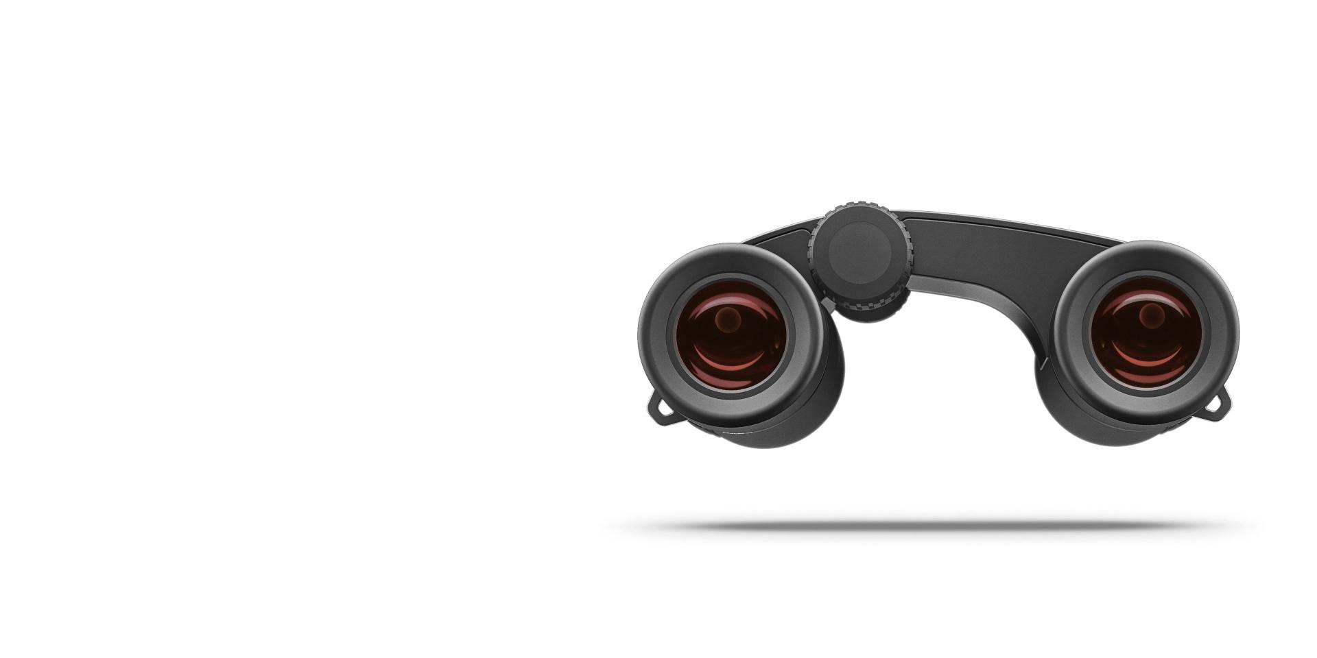 Front view of a compact black ZEISS binocular with red-tinted lenses on a white background.