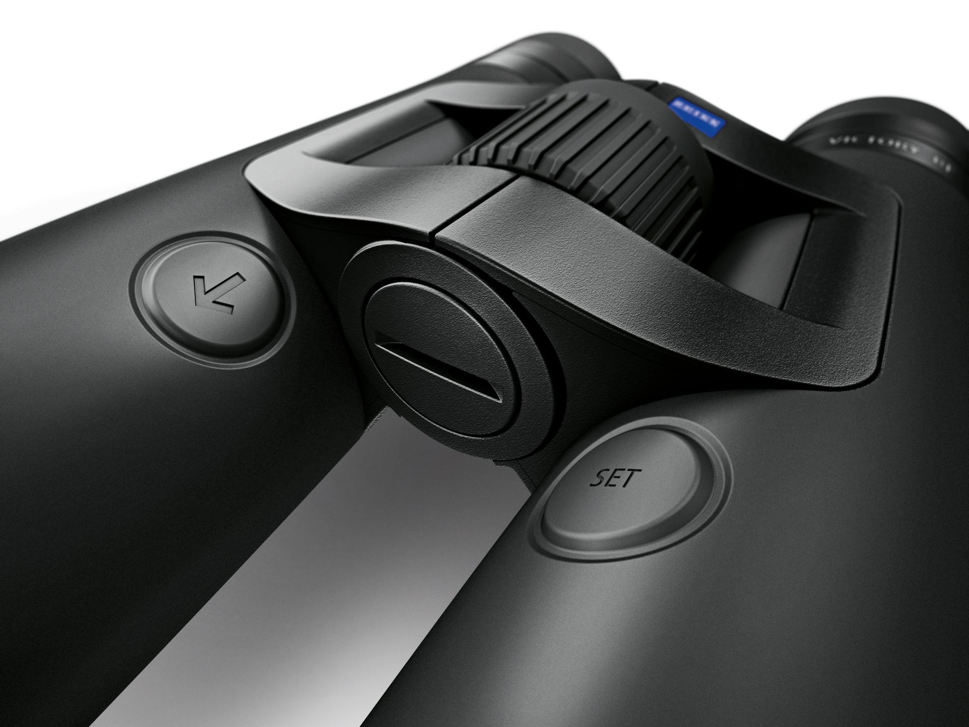 Close-up view of the central focus wheel and control buttons on a pair of ZEISS binoculars.