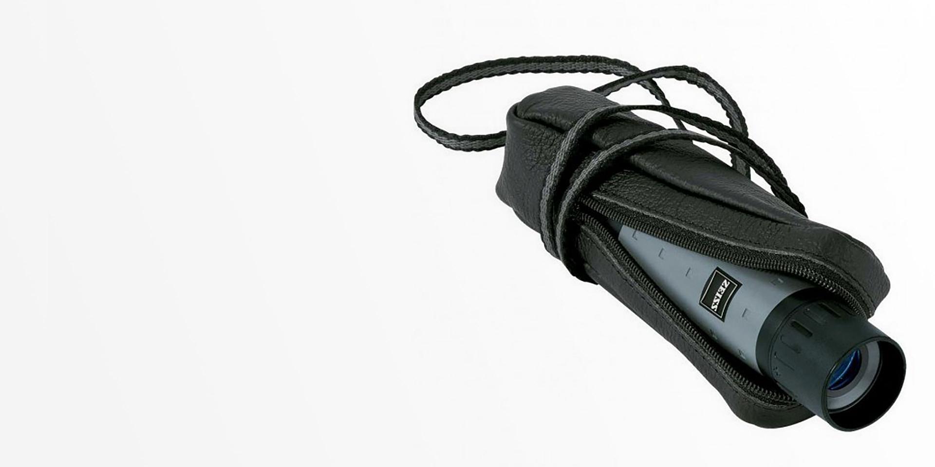 Compact ZEISS monocular with a protective case and neck strap placed on a white background.