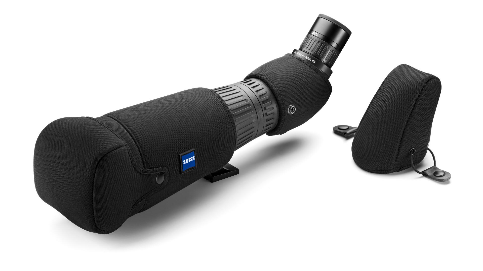A ZEISS spotting scope with a protective black cover and a detached eyepiece cap shown on a white background.