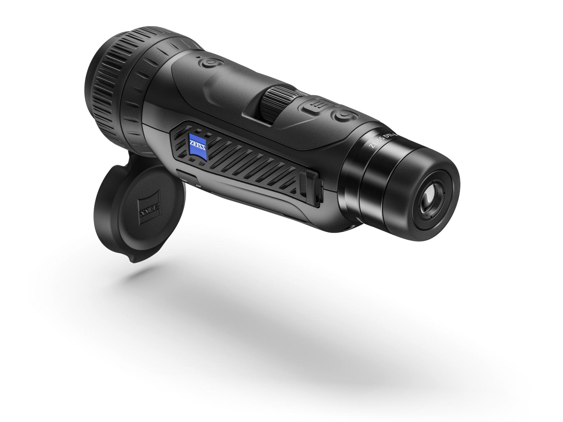 Black ZEISS thermal imaging monocular with textured grip, labeled ZEISS on the side, and a lens cap hanging open.