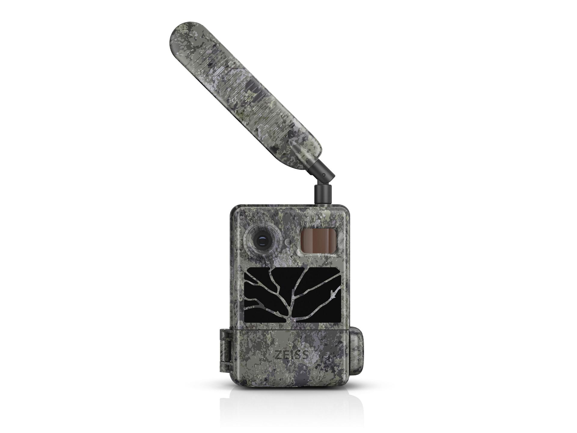 Camouflage-patterned ZEISS trail camera with an extended antenna, lens, sensor, and display screen on the front.