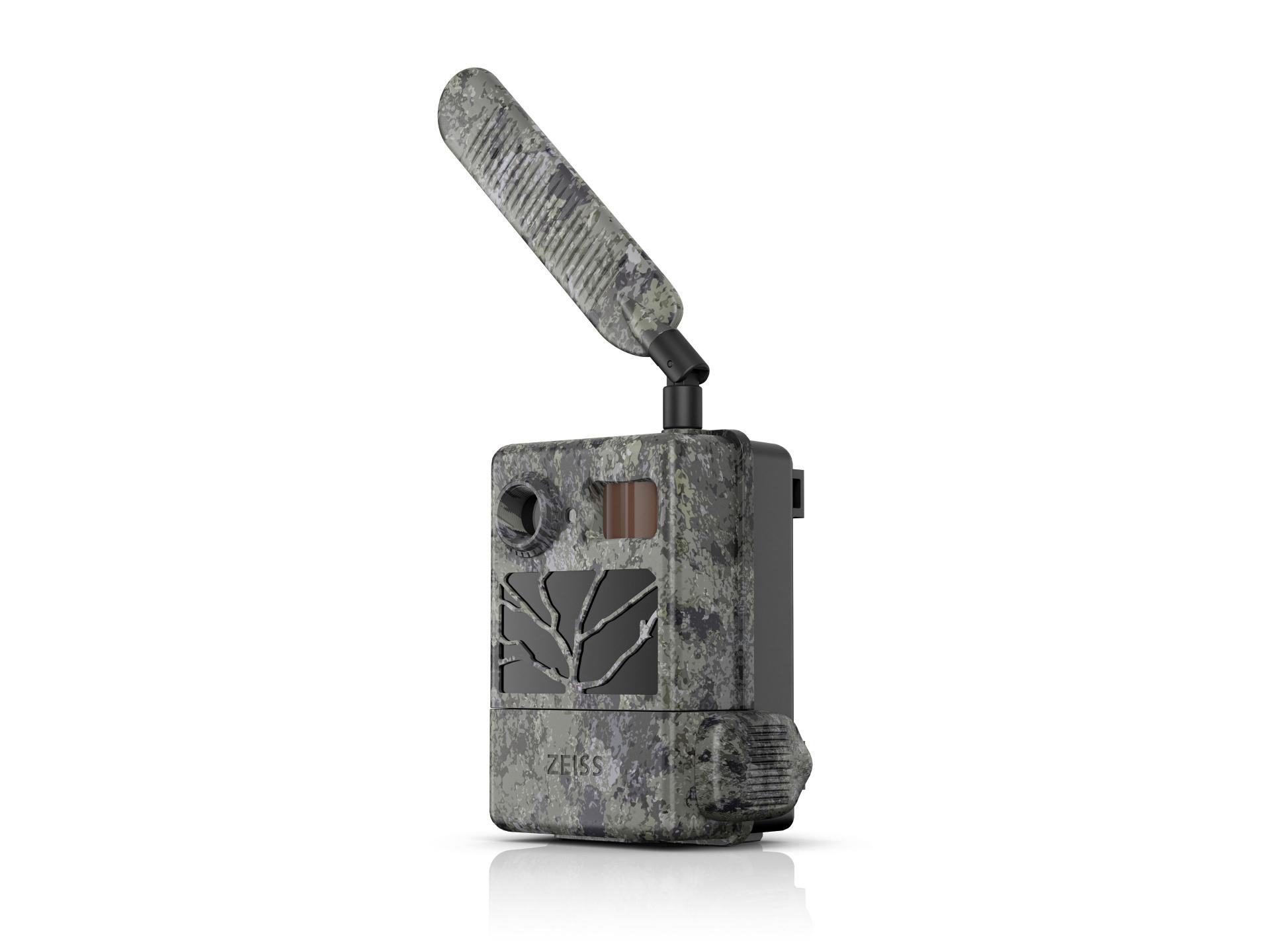 Camouflaged ZEISS trail camera with an external antenna, a front-facing lens, and ZEISS branding visible on the lower front panel.