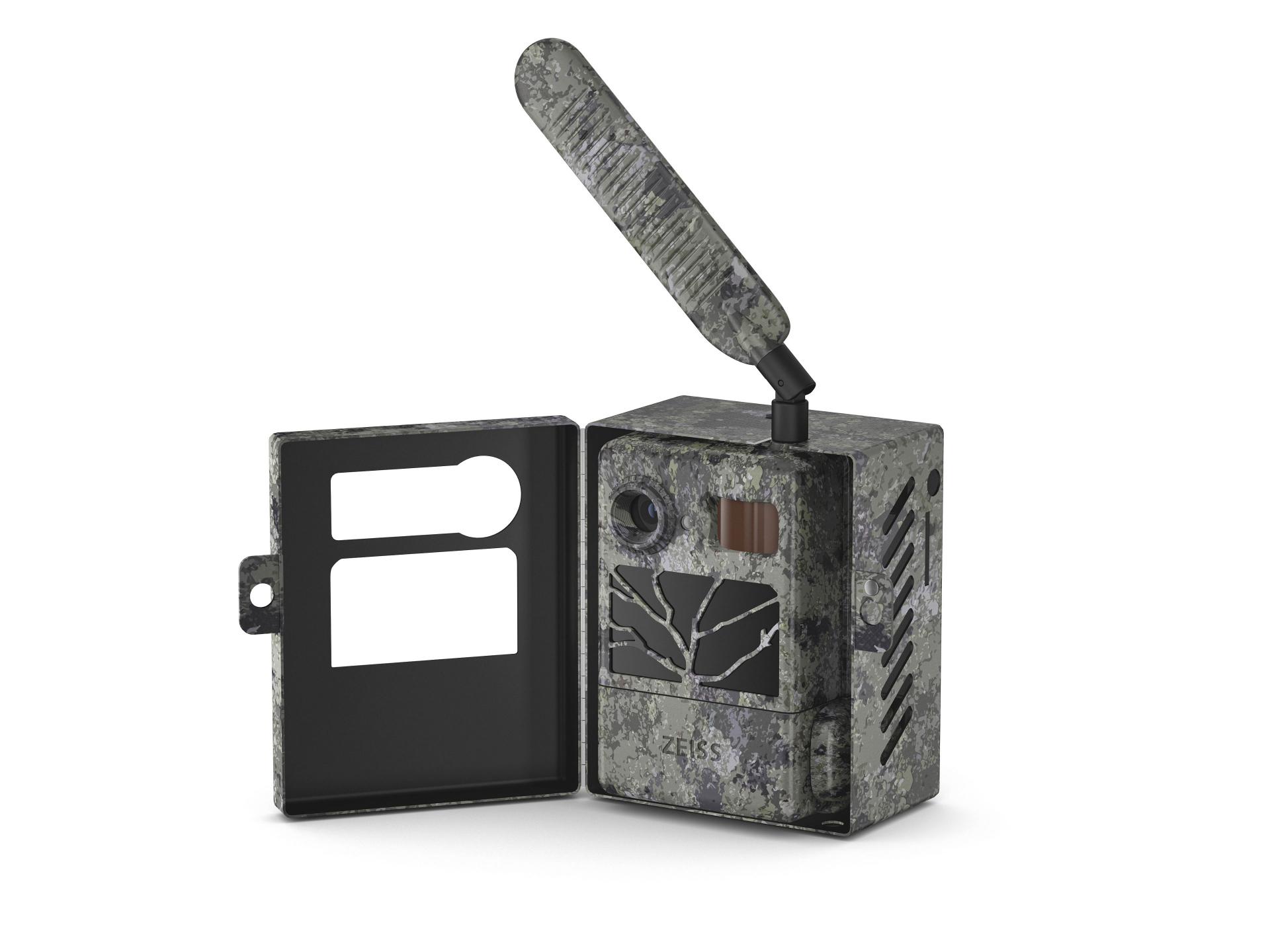 Camouflage-patterned ZEISS trail camera with an open front cover and an extended antenna, designed for outdoor wildlife monitoring.