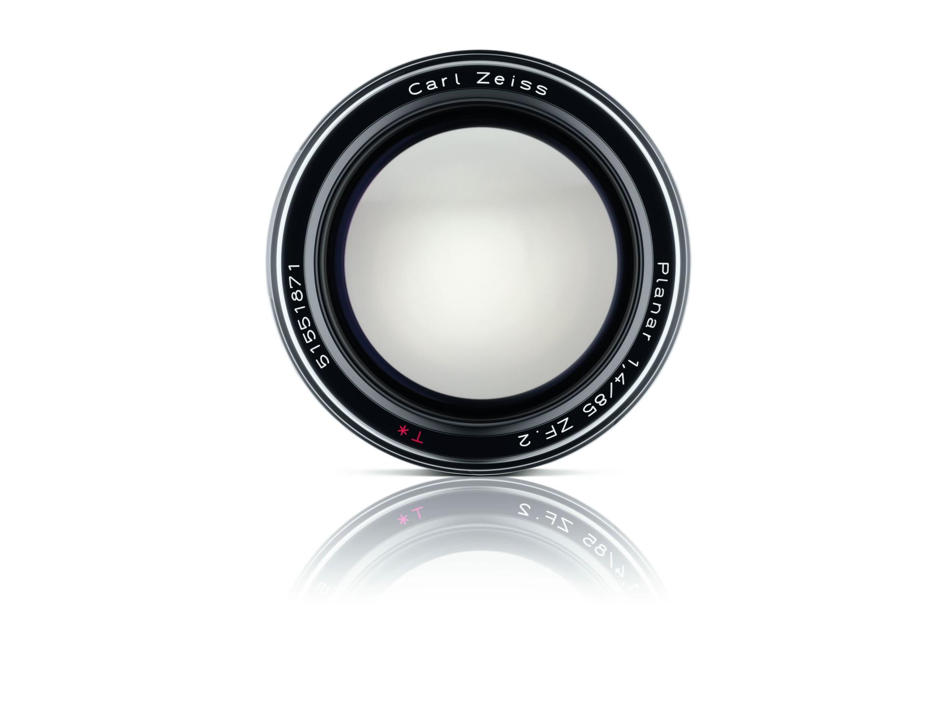 Front view of a Carl ZEISS Planar 85mm f/1.4 camera lens with reflective surface beneath.