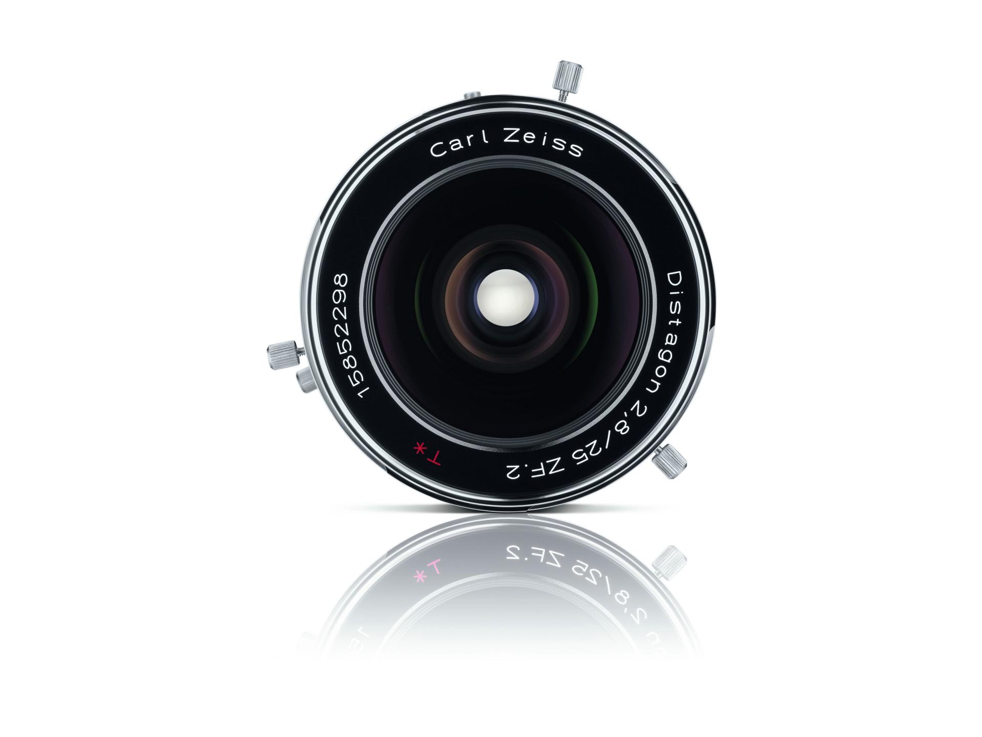 Front view of a Carl ZEISS Distagon 2.8/25 ZF.2 camera lens with reflective surface beneath.