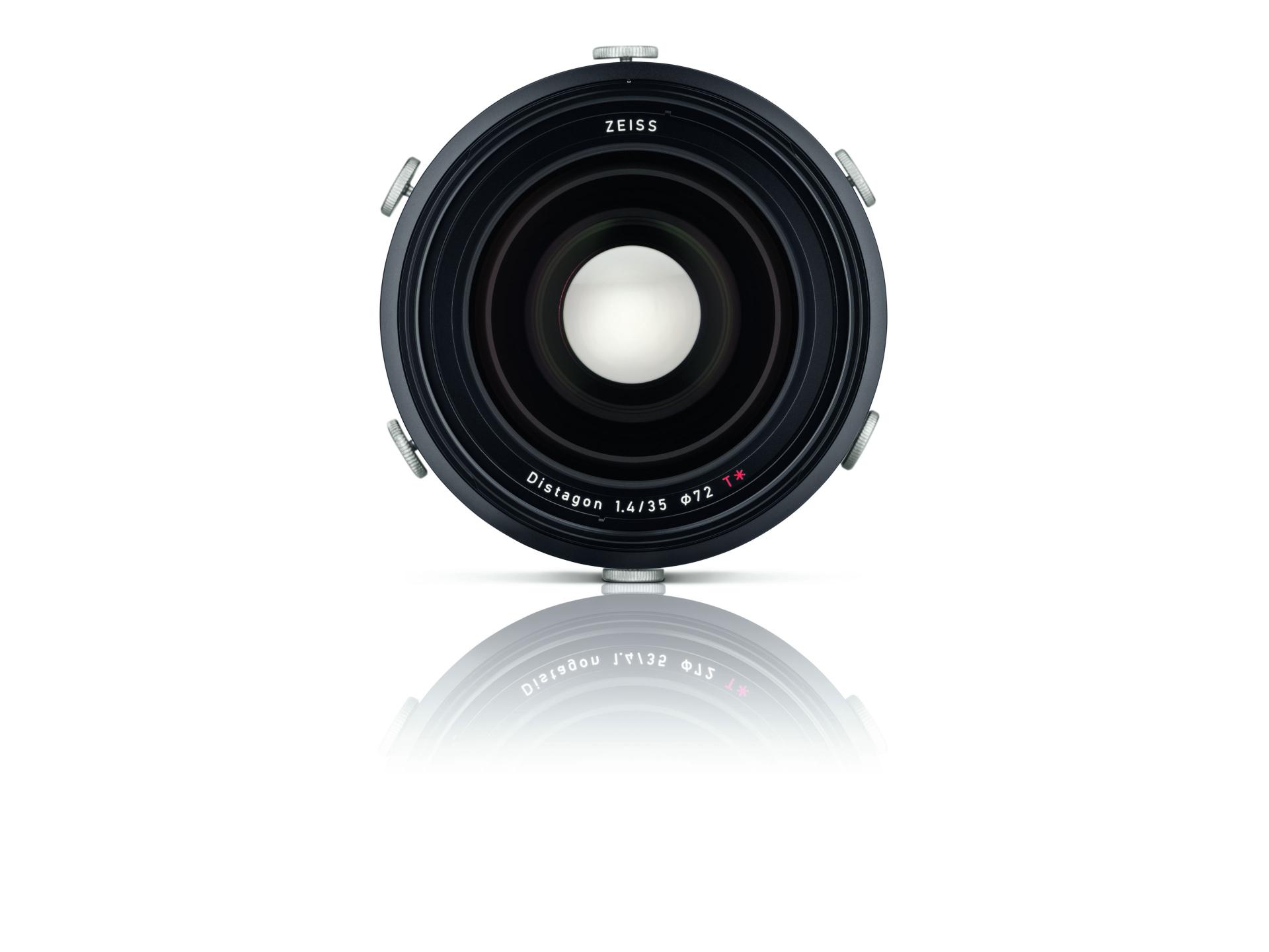 Front view of a ZEISS Distagon 1.4/35 camera lens with reflection on a white background.