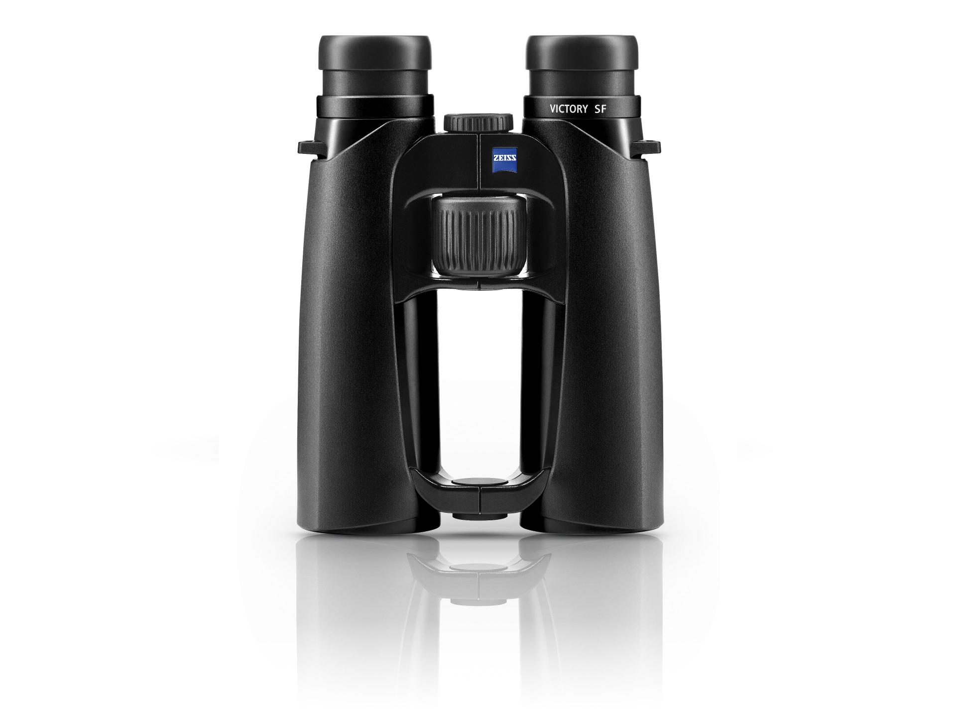 Black ZEISS VICTORY SF binoculars standing upright on a reflective white surface, viewed from the front.