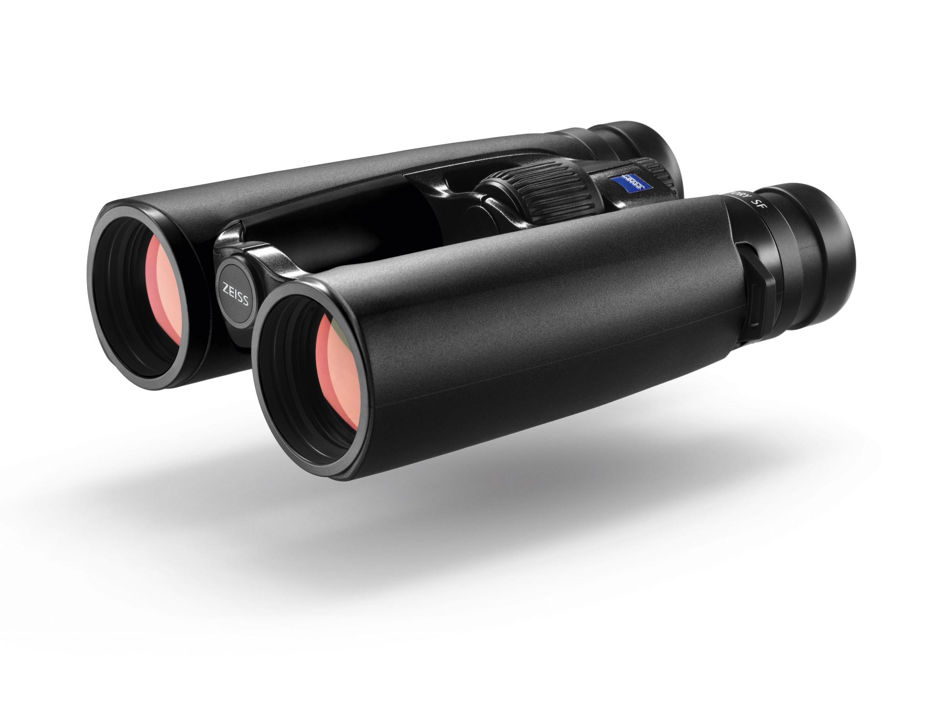 Black ZEISS binoculars with red-tinted objective lenses and a central focus wheel, shown from an angled front view.