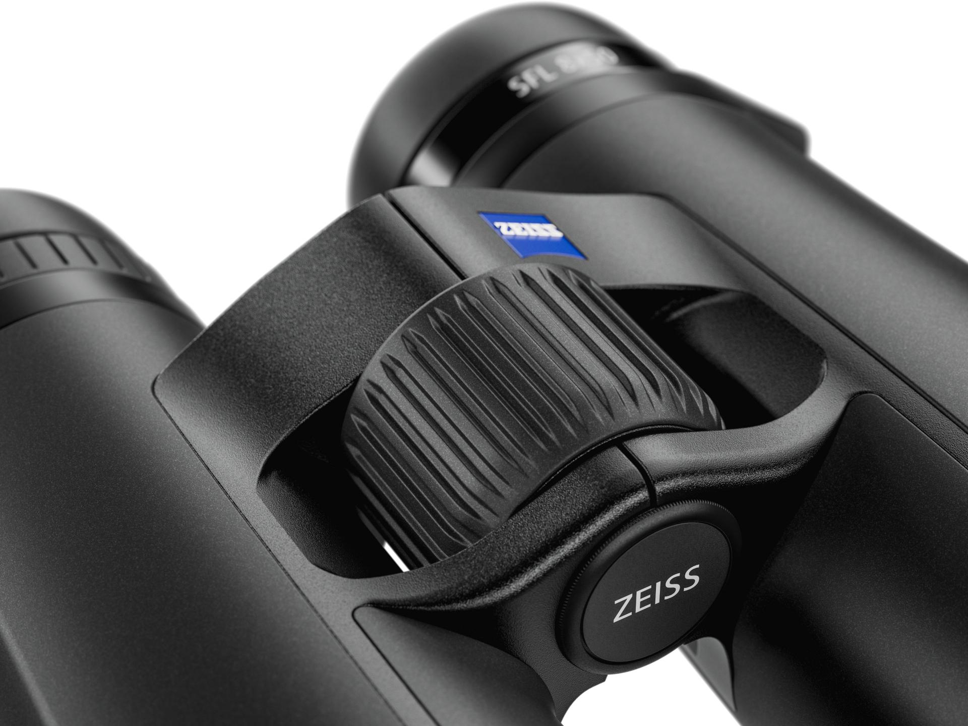 Close-up view of a black ZEISS binocular focusing wheel with the ZEISS logo prominently displayed.