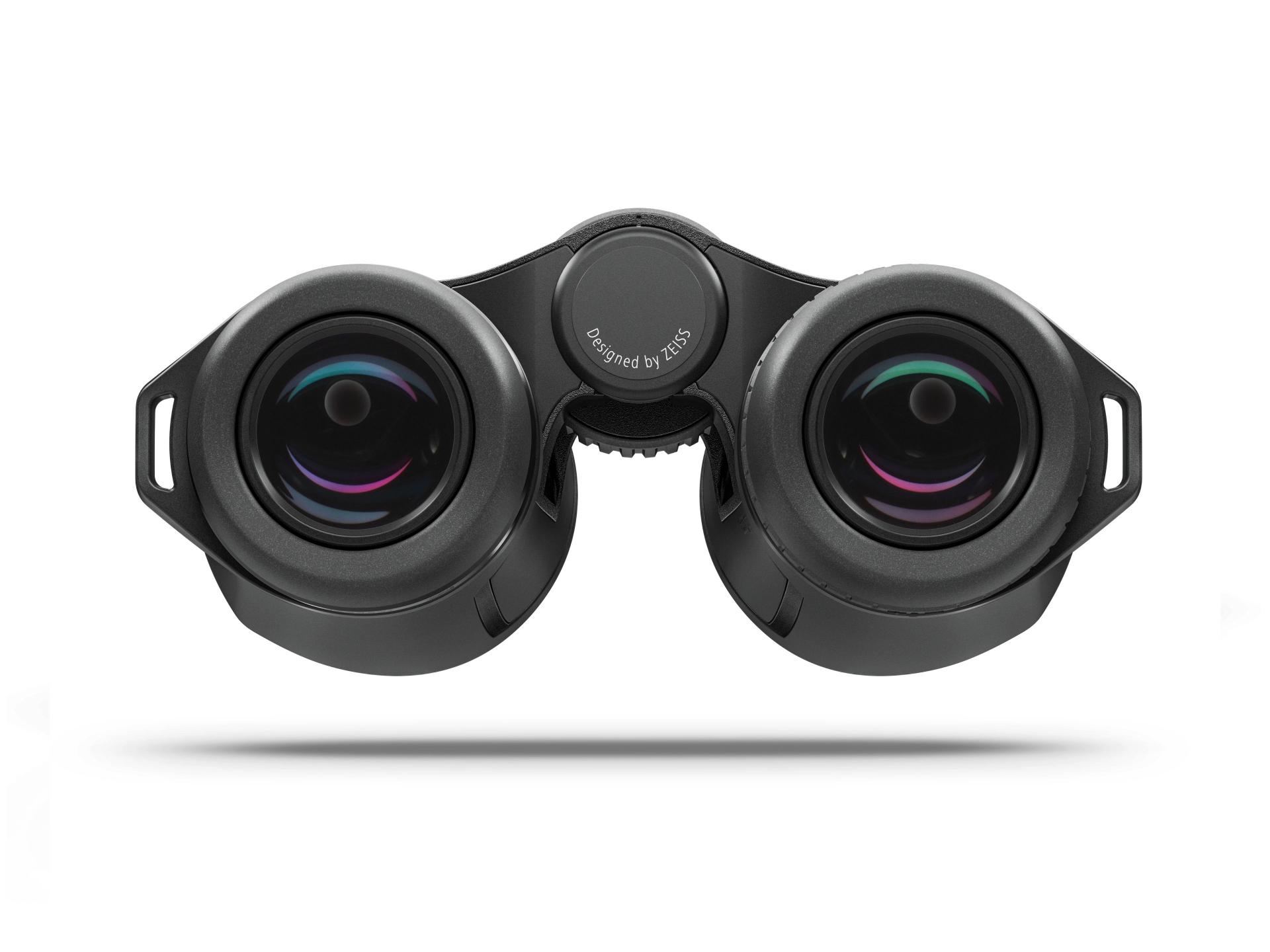 Rear view of a pair of black binoculars with multi-coated lenses and "Designed by ZEISS" written on the center hinge.