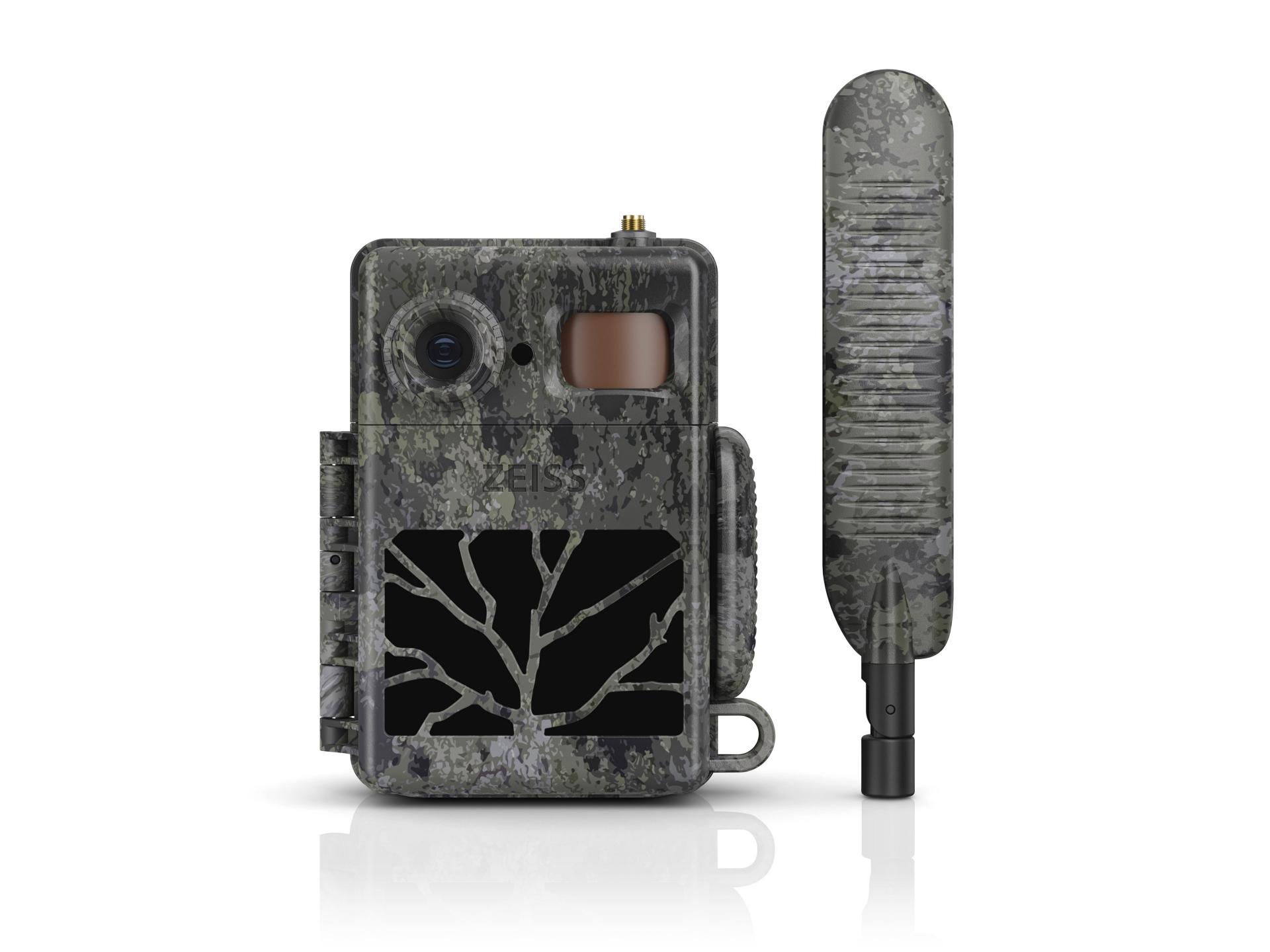 Camouflaged ZEISS trail camera with matching external antenna, featuring a rugged design and tree-branch pattern on the front panel.