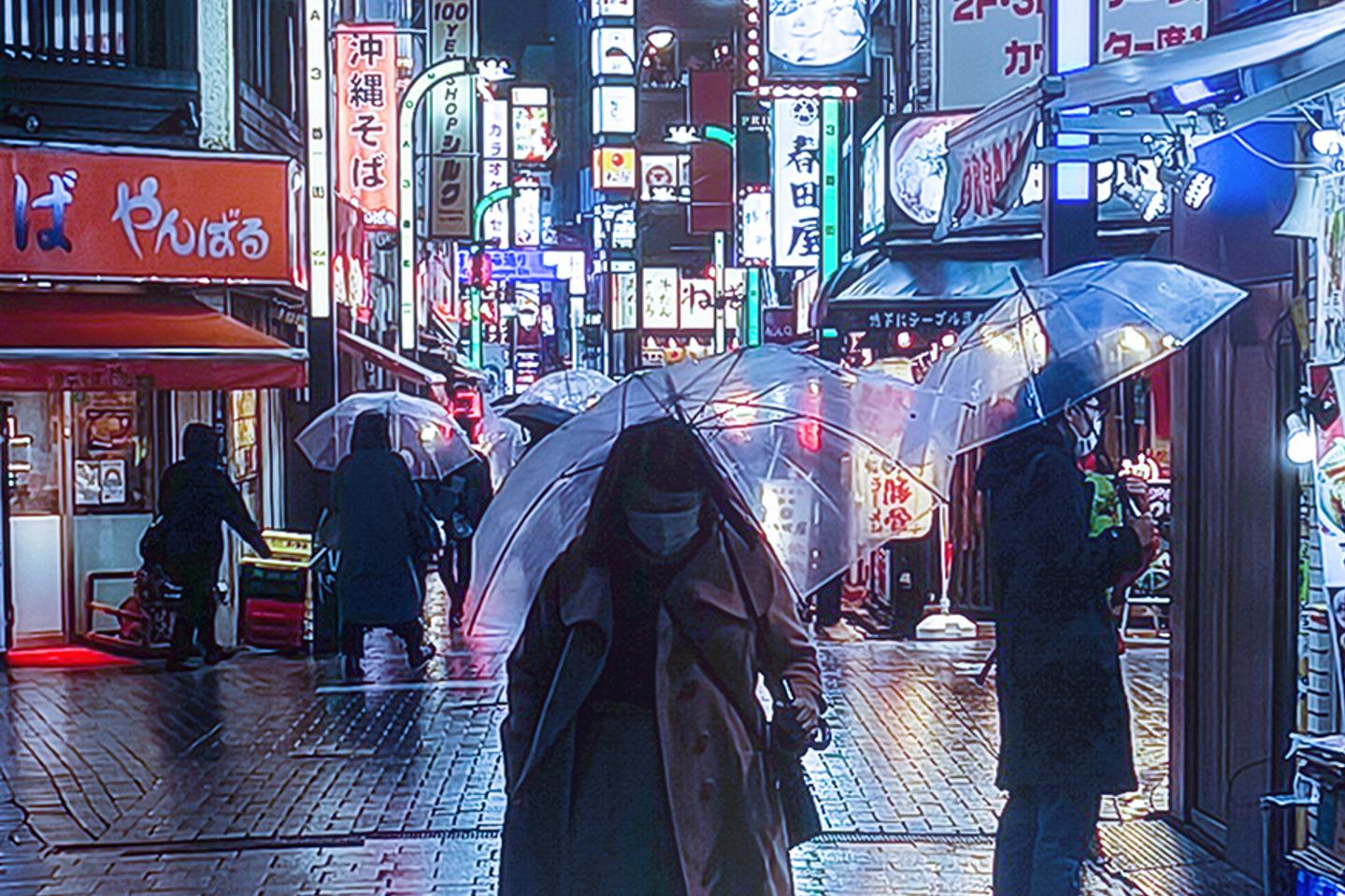 People walk with transparent umbrellas along a brightly lit, rainy street in an urban area at night, with colorful illuminated signs in the background.