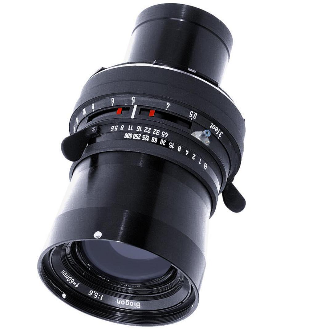 Black ZEISS camera lens with detailed focus and aperture markings, isolated on a white background.