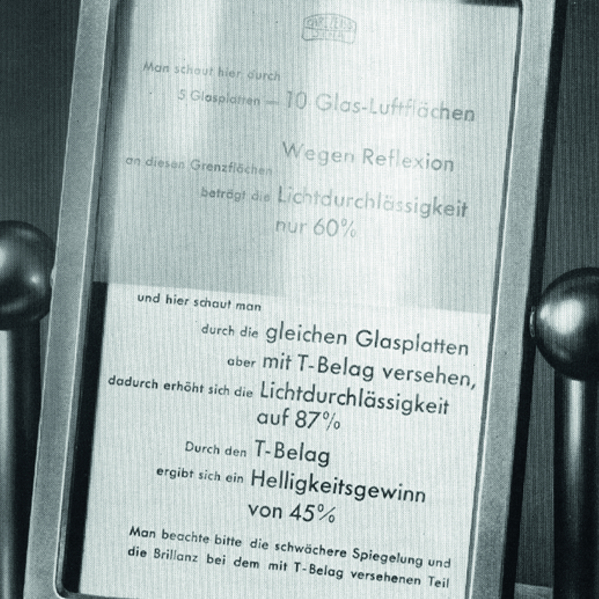 Display showing a comparison between untreated and T-coated glass plates, demonstrating differences in light transmission and reflection, presented in a ZEISS exhibit.