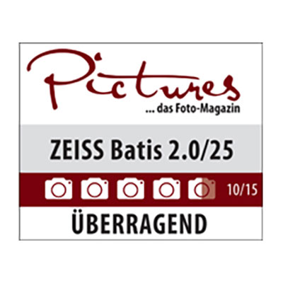 Award graphic from “Pictures – das Foto-Magazin” showing a 10/15 rating for the ZEISS Batis 2.0/25 lens with the label “ÜBERRAGEND.”