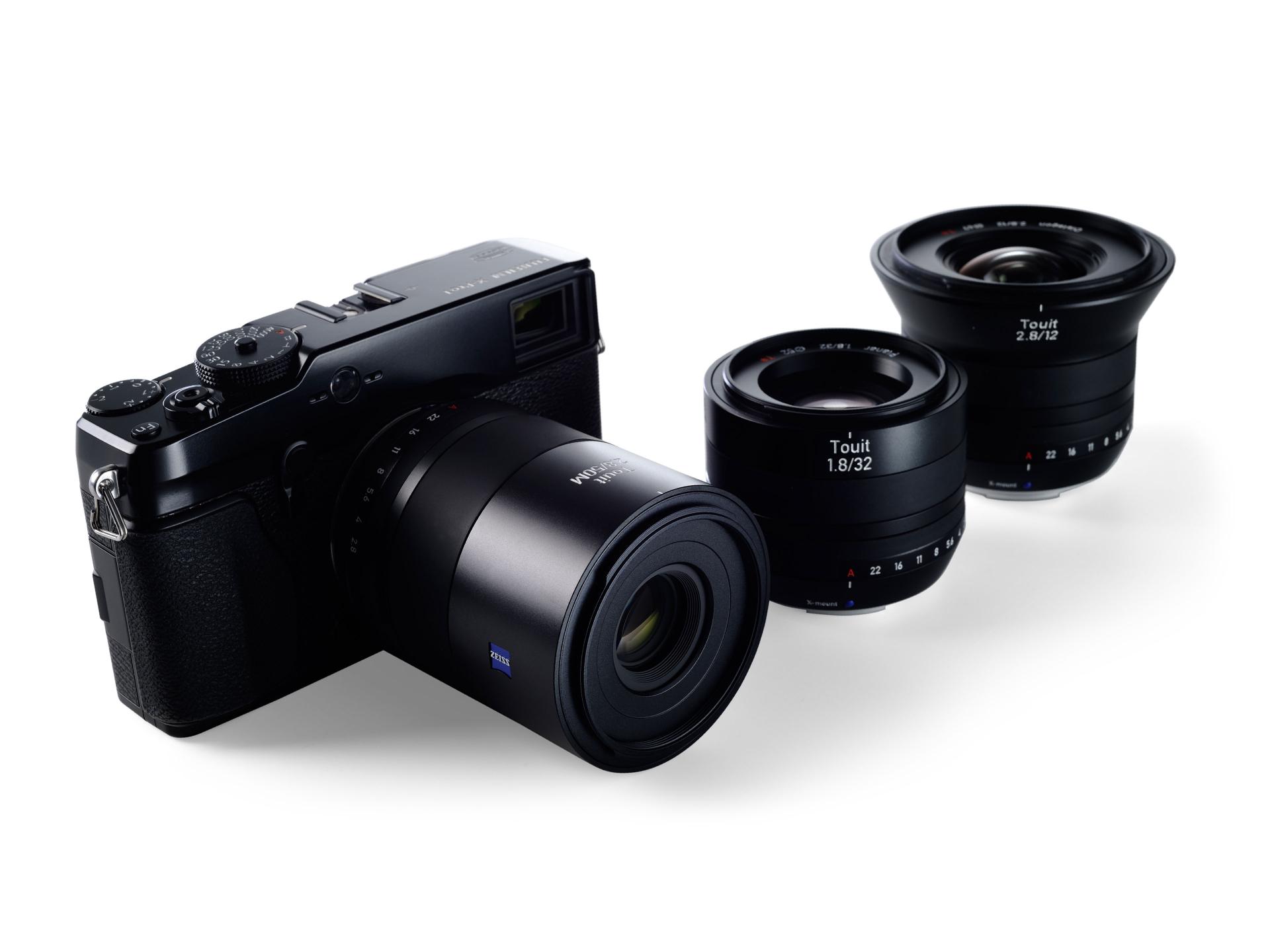 Close-up image of a ZEISS Touit 2.8/50M camera lens mounted on a black camera body, highlighting the aperture ring and focusing details.