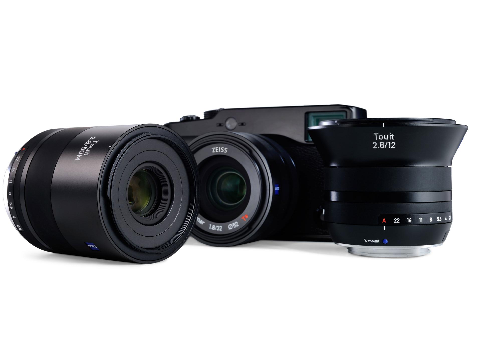 Close-up view of a ZEISS Distagon 2.8/12 camera lens with visible T* coating marking and 67mm filter thread size.
