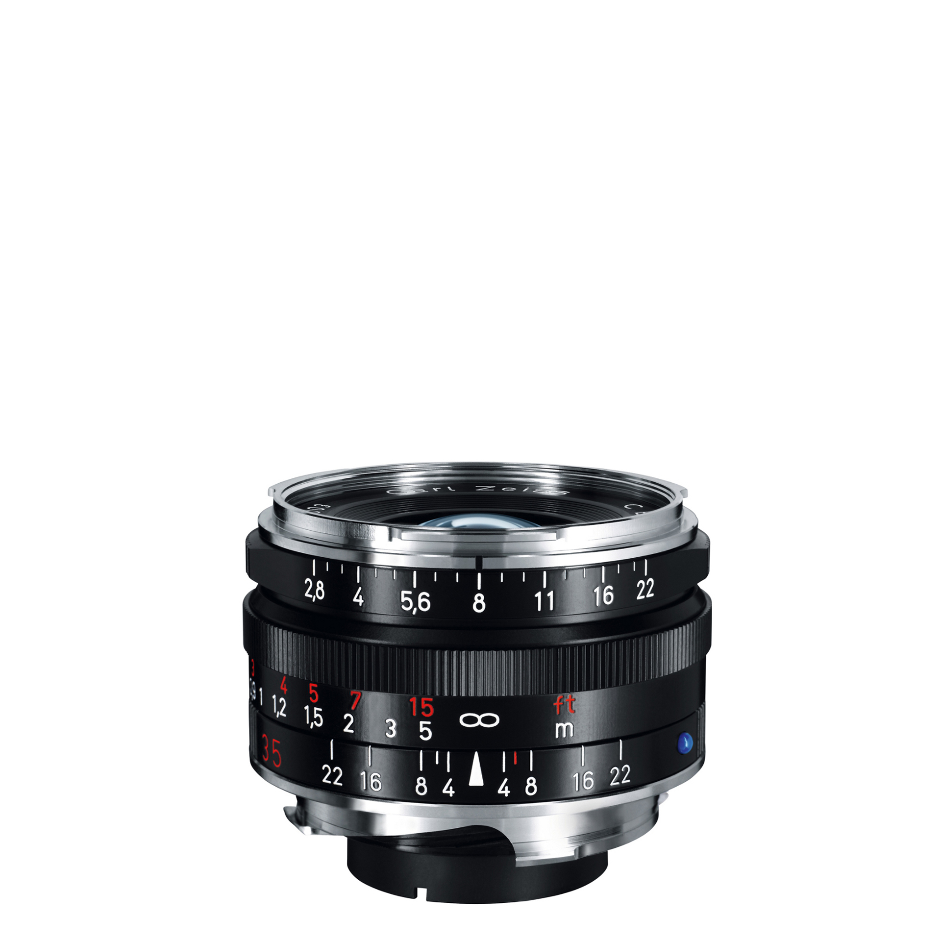 Compact ZEISS camera lens with a black and silver metal body, featuring manual focus and aperture control rings with engraved distance and f-stop markings.