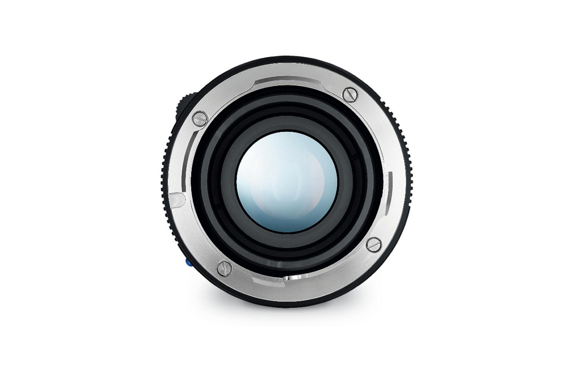 Close-up view of a ZEISS camera lens with a metallic mount and central glass element.