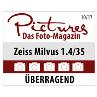 Award graphic from *Pictures Das Foto-Magazin* rating the ZEISS Milvus 1.4/35 lens with five cameras and a verdict of “ÜBERRAGEND” (outstanding).