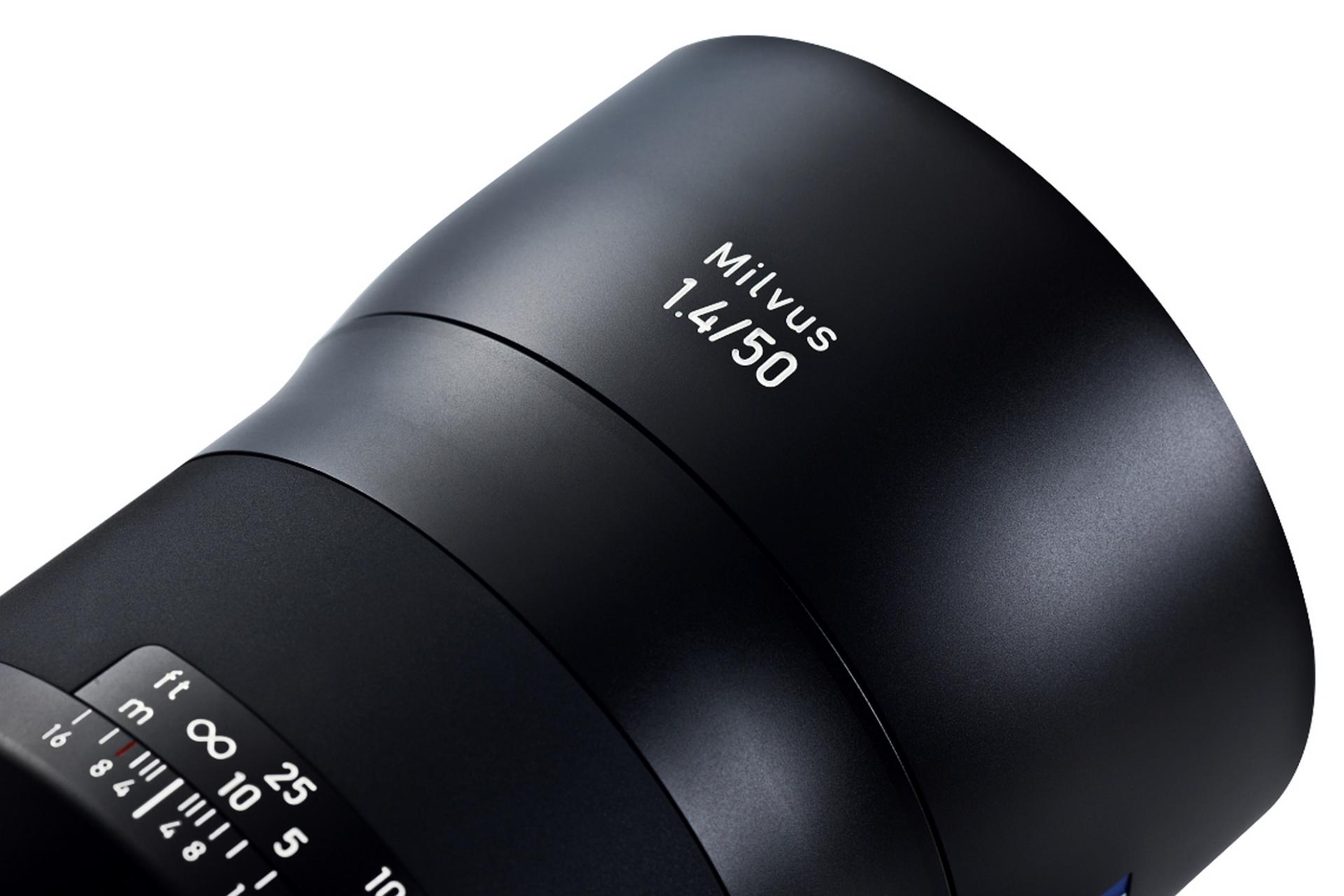 Close-up view of a ZEISS Milvus 1.4/50 camera lens showcasing its sleek black design and engraved aperture and focus markings.