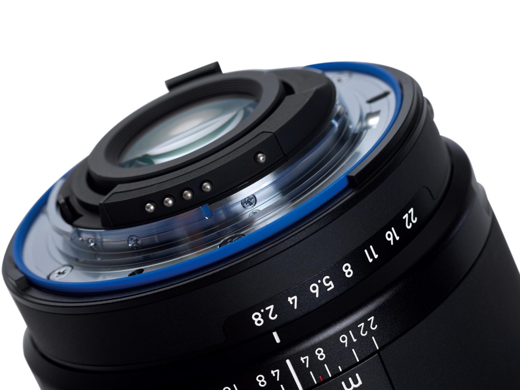 Close-up view of the rear element and aperture markings on a ZEISS camera lens.