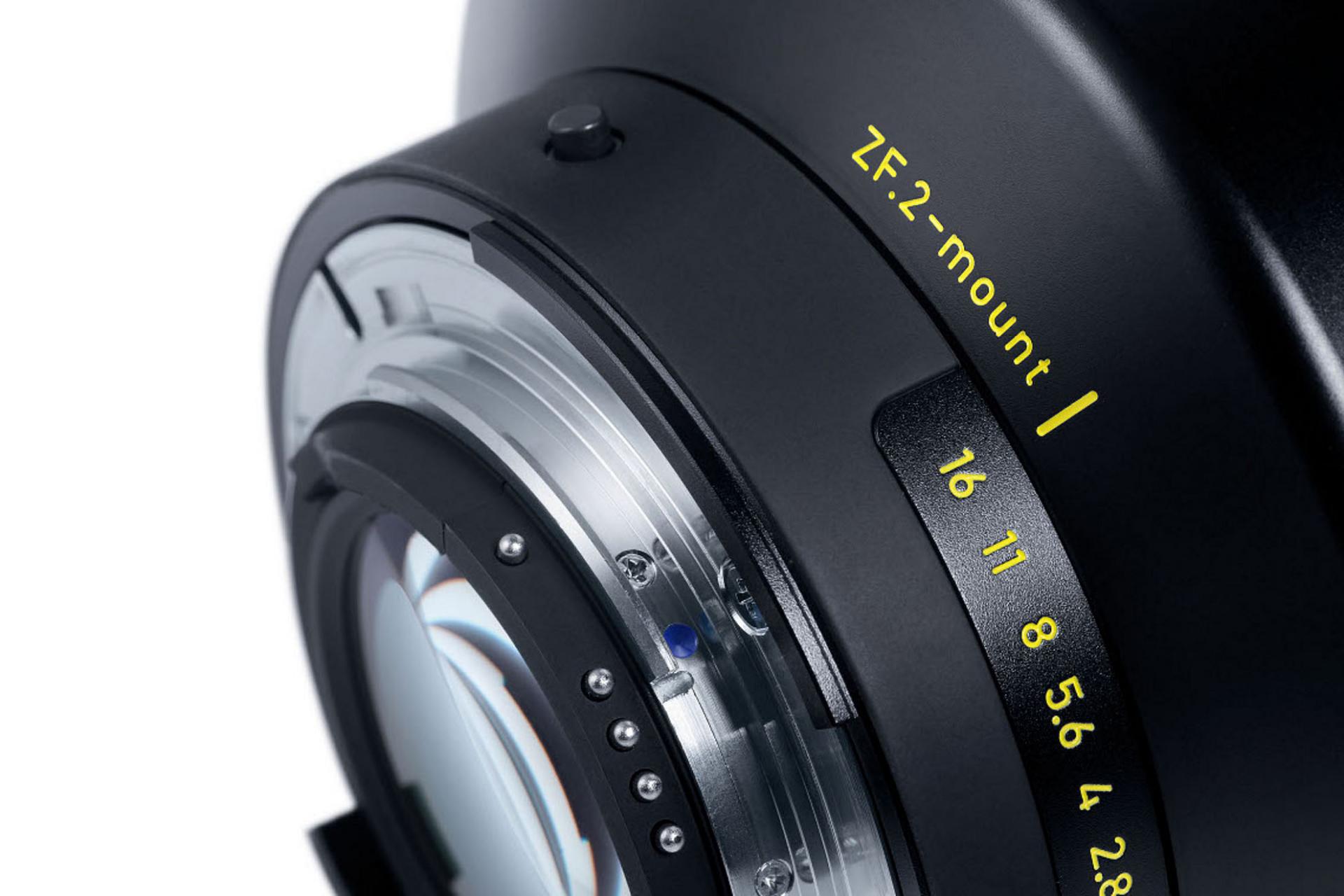 Close-up view of a ZEISS camera lens mount labeled "ZE-2-mount" with aperture values clearly marked in yellow.